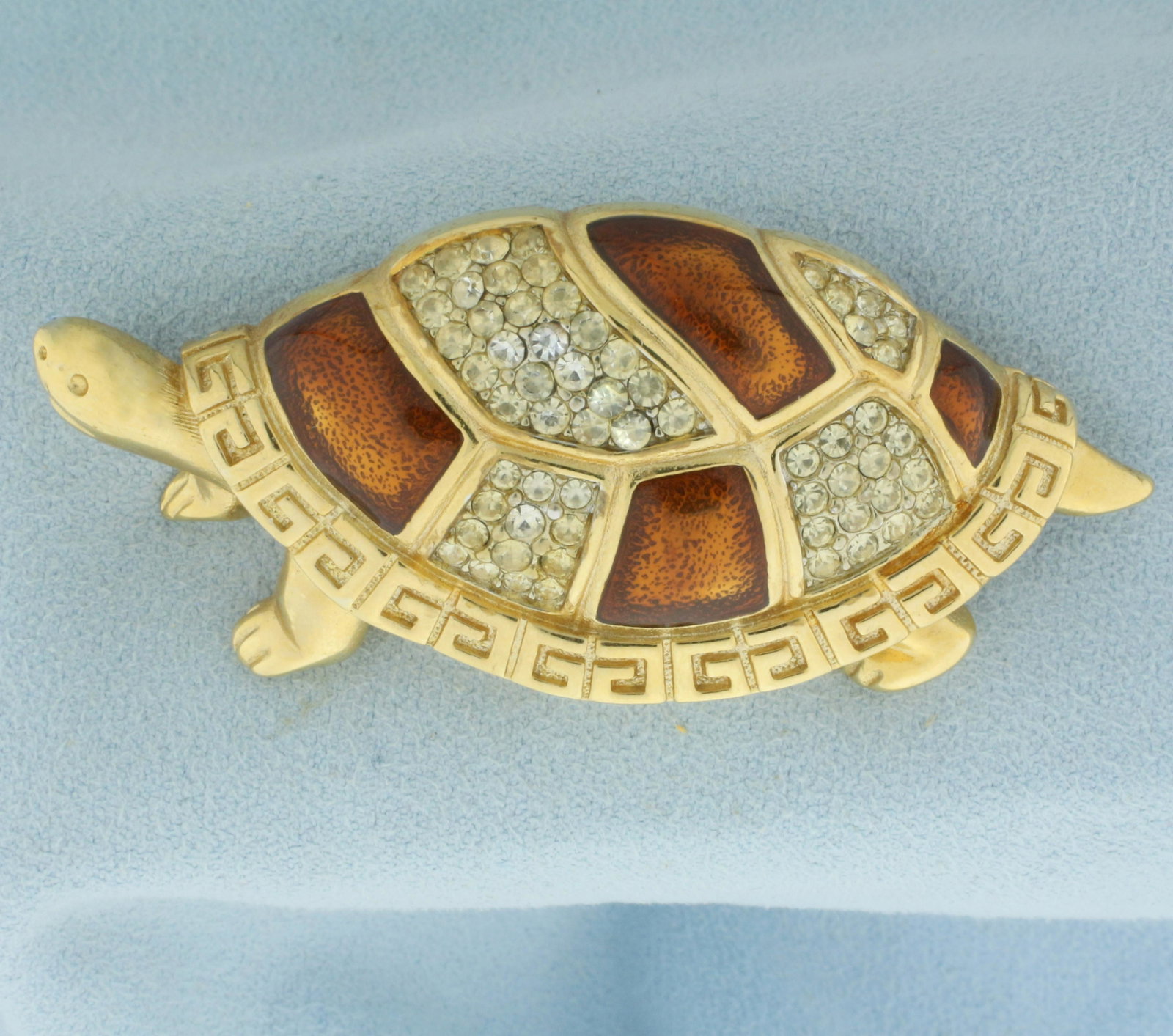 Vintage Designer Givenchy Signed Enamel And Crystal Turtle Pin Brooch: Gold plated. Circa 1980s, signed on back. 2 1/4 inch x 1 1/8 inch. Accented with iconic Givenchy logo on shell and copper enamel with rhinestone crystals.