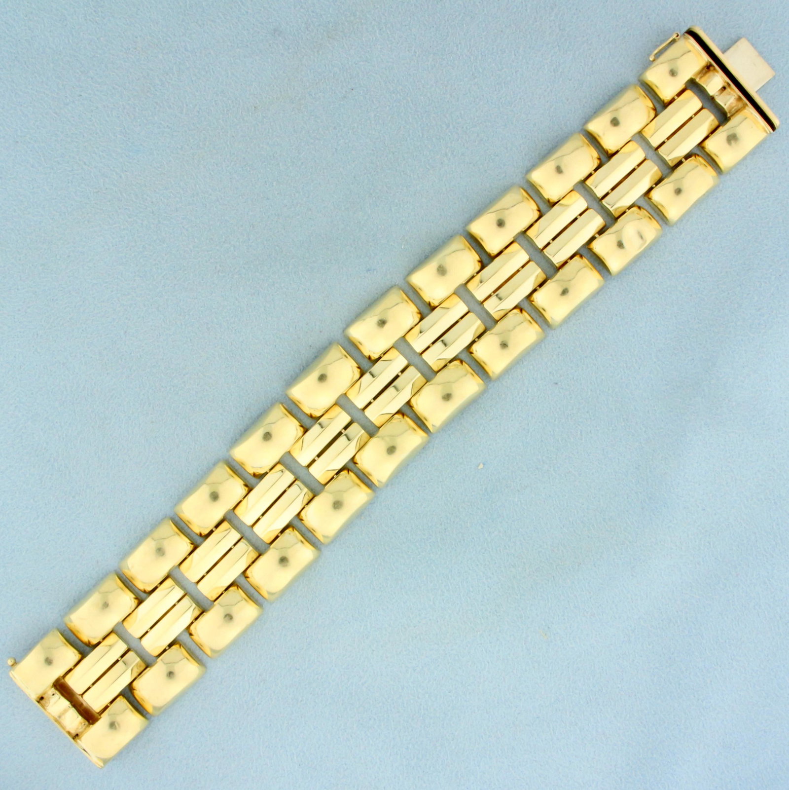 Designer Panther Link Bracelet in 14K Yellow Gold: In 14K Yellow Gold. Safety clasp. 7 inches long. 1 inch wide. 42.3g