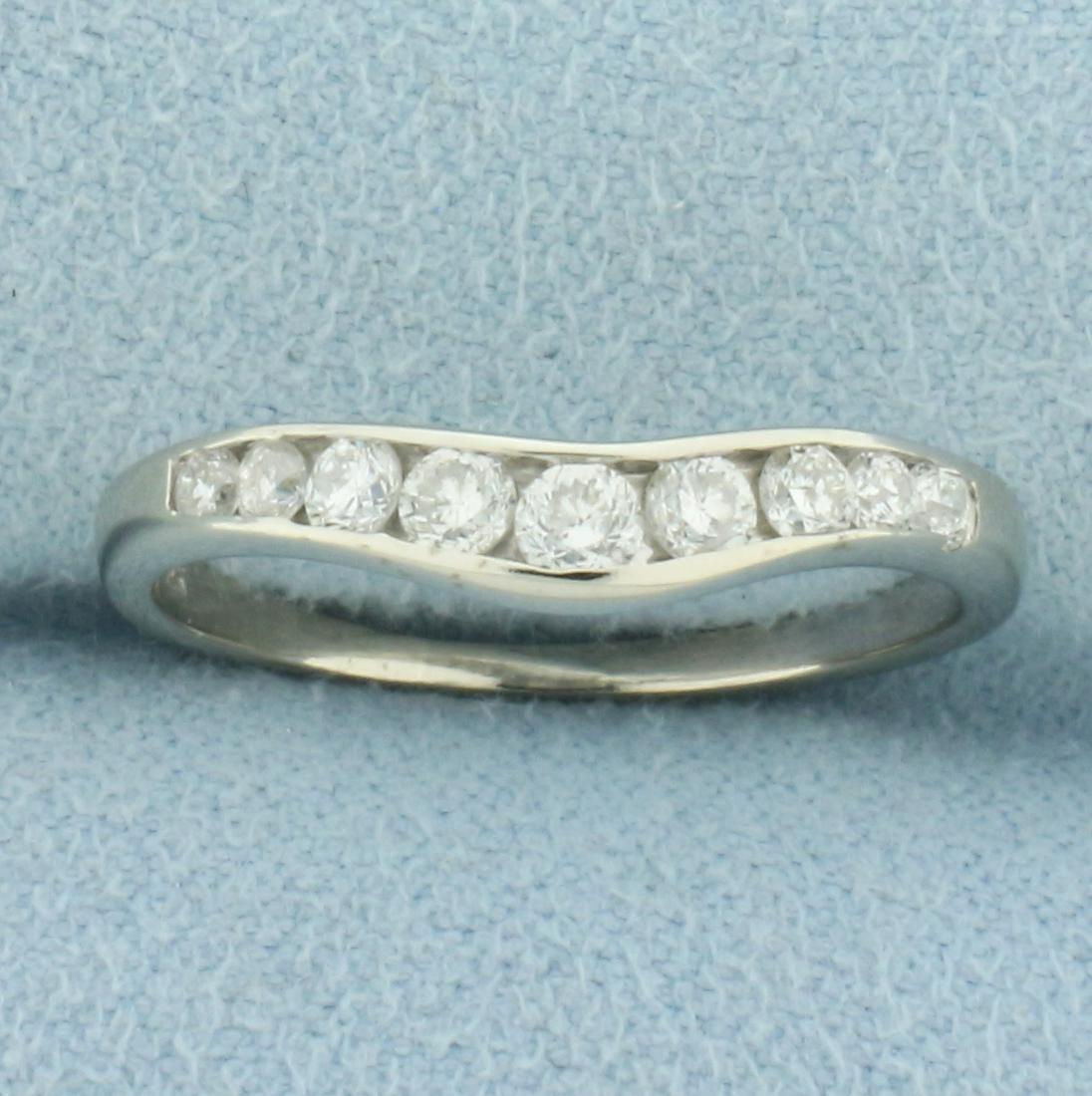 Curved Diamond Wedding Band Ring in 14k White Gold: In 14k white gold. Contains 9 round cut diamonds, 1/3ctw, SI clarity/H color. Can by worn by itself or will curve around diamond engagement ring to sit flush against it. Size 7.75. 1.9g.
