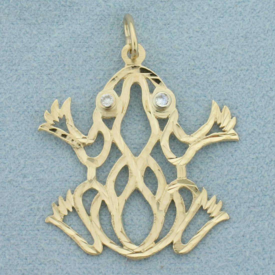 Diamond Frog Pendant in 14k Yellow Gold: 14k Yellow Gold. Contains two .03ct diamonds as eyes, I color/I clarity. 1 1/4 inch long with bale, 1 inch wide. Diamond cut for extra sparkle. 1.9g.