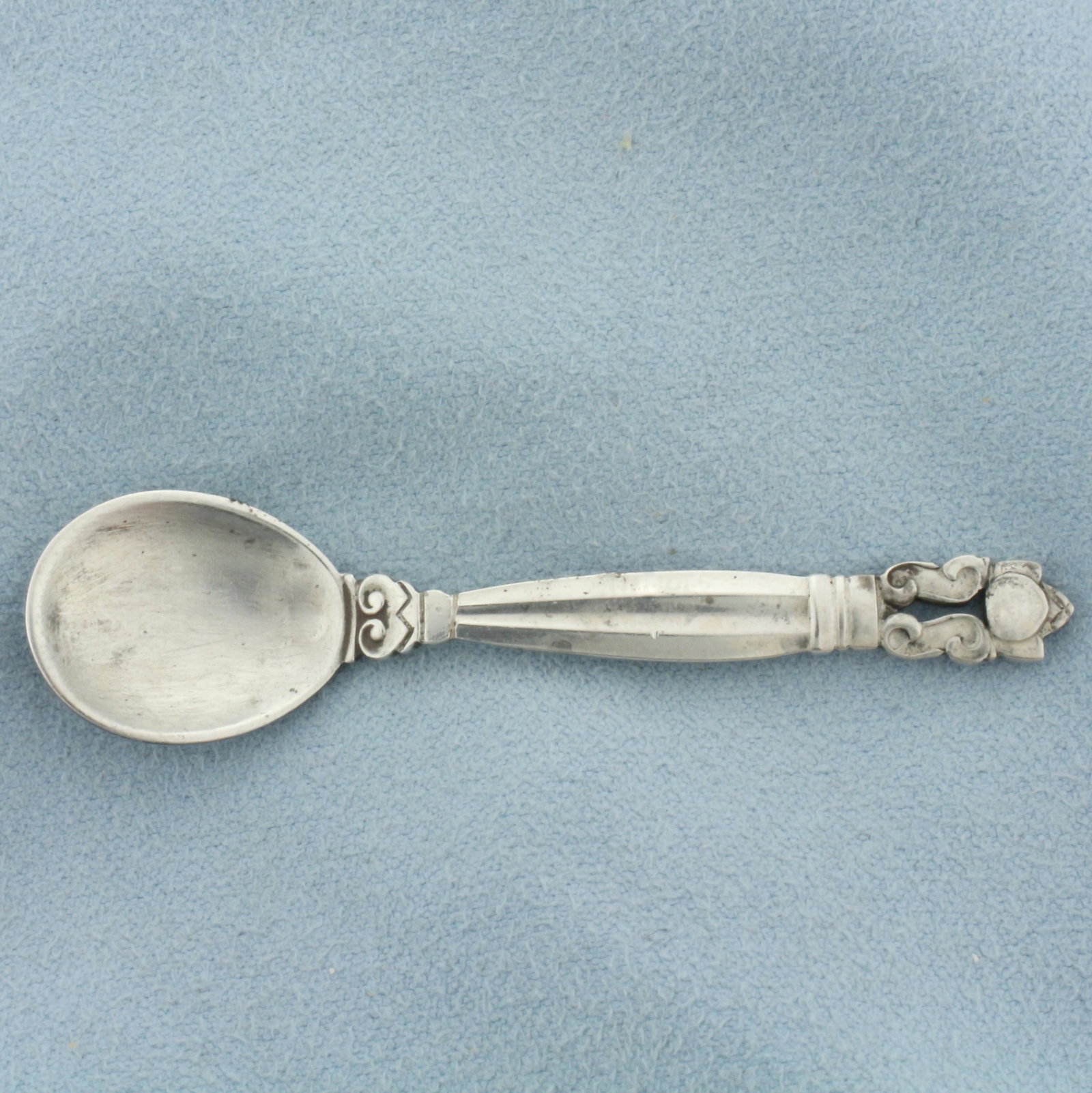 Georg Jensen Sterling Silver "Acorn" Salt Spoon in .925 Sterling Silver: In .925 Sterling Silver. Designed by legendary Johan Rohde. 2 3/8 inches x 9/16 inches wide. 4.6g.