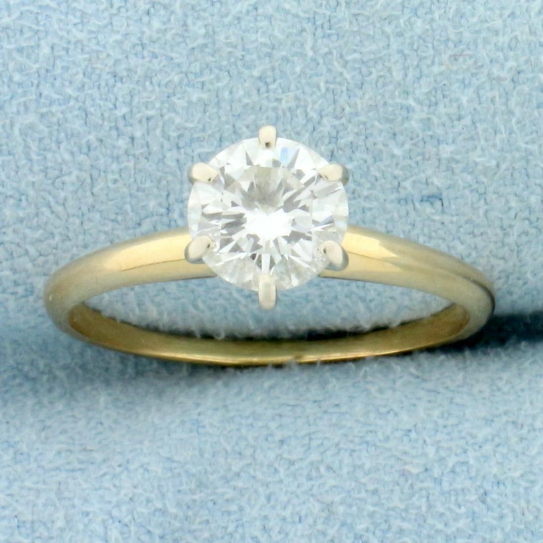 Almost 1ct Diamond Solitaire Engagement Ring in 14K Yellow Gold: In 14K Yellow Gold. Contains one high quality .9ct Round Brilliant Diamond, VVS clarity/I color. Size 6 1/2. 2.0g