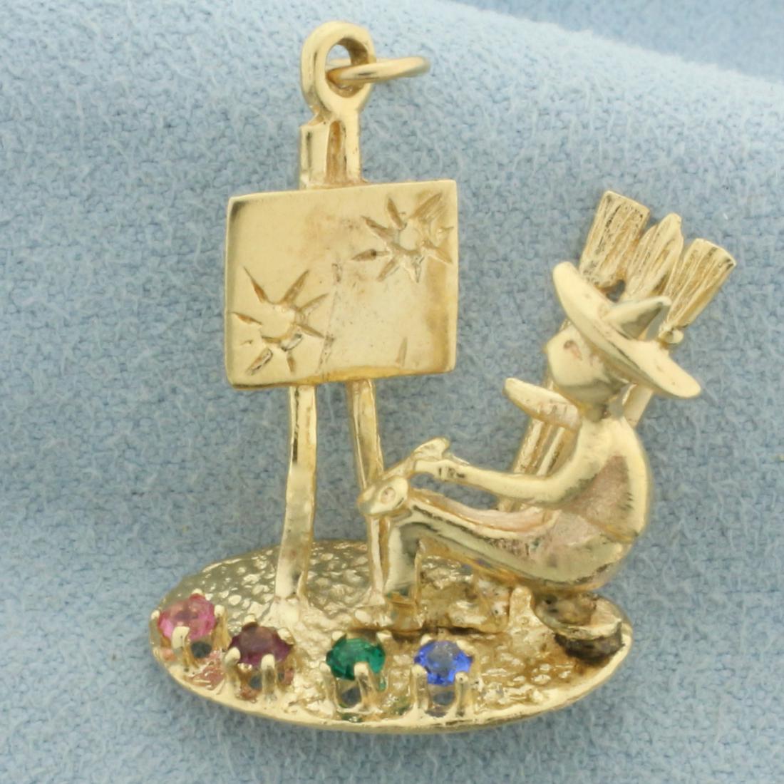 Vintage Van Gogh Starry Night Pallet 3D Charm or Pendant in 14k Yellow Gold: In 14k yellow gold. 3D Image of painter with one 2mm pink sapphire, ruby, emerald, and sapphire gemstone. 1 inch high by 7/8 wide. 4.7g.