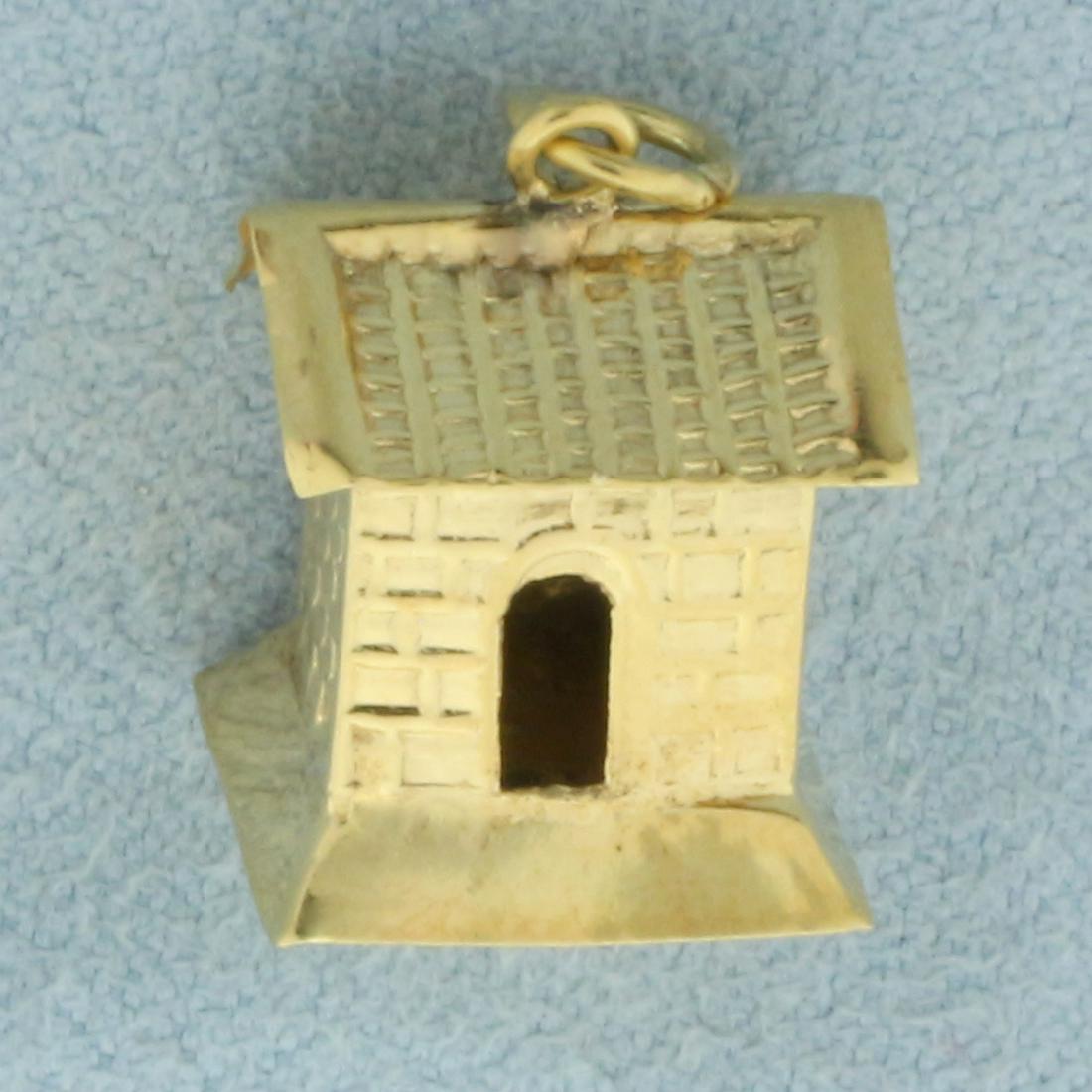 3D House Charm in 14k Yellow Gold: In 14k yellow gold. 5/8 inch long, 3/8 inch wide. 1.2g.