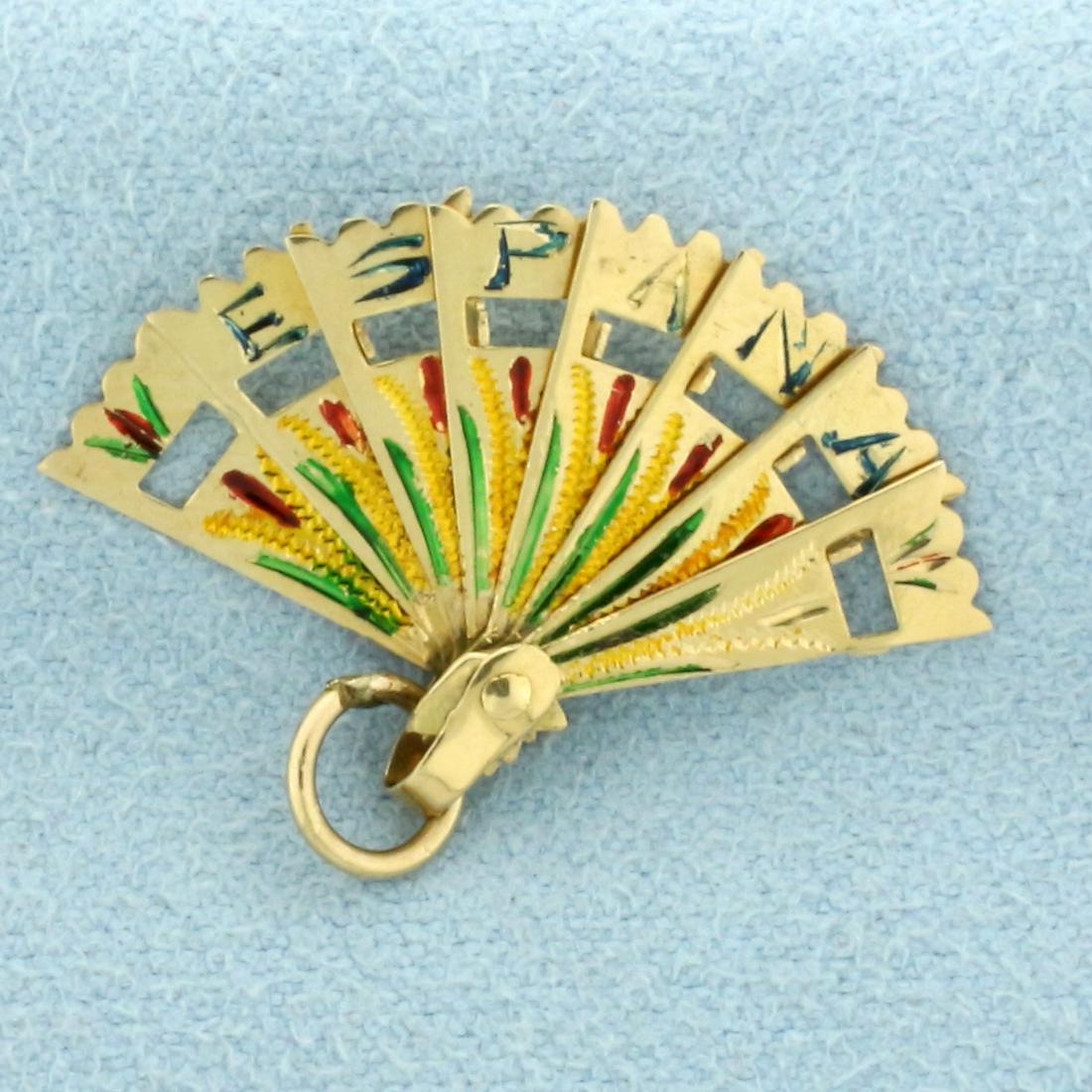 Vintage Mechanical Spain Espana Enamel Fan Charm in 18k Yellow Gold: In 18k yellow gold. 1 inch wide x 3/4 inches long (including jump ring). Fan opens/closes. 1.1g,