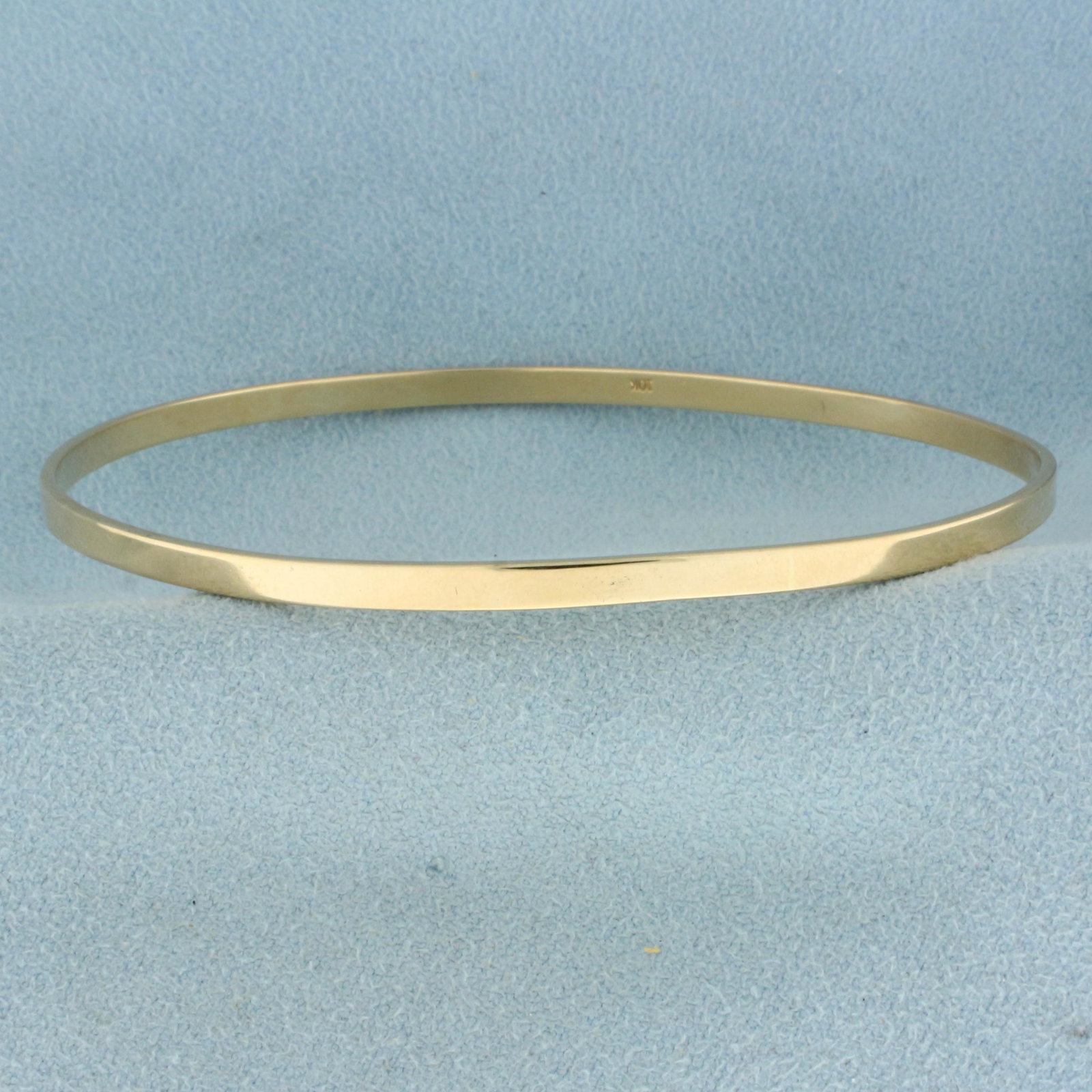 Classic Bangle Bracelet in 10K Yellow Gold: In 10K Yellow Gold. 2 3/4 inch inner diameter, 2.9mm wide. 8.3g.