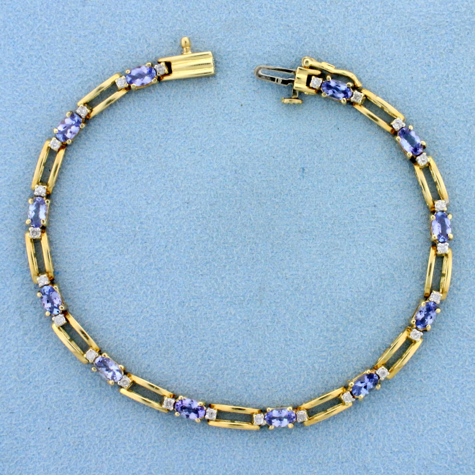 3ct TW Natural Tanzanite and Diamond Bracelet in 14K Yellow Gold: In 14K Yellow Gold. Contains twelve 1/4ct high quality natural Tanzanite gemstones with bright purple color and excellent clarity. Also contains twenty four high quality .01ct Diamonds - I color/I1 cl