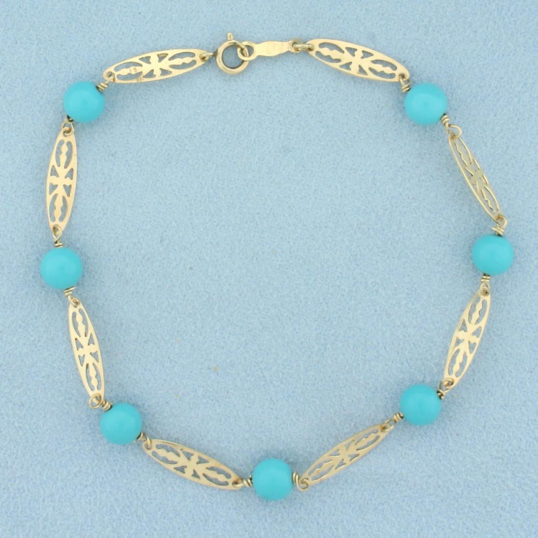 Turquoise Bead Bracelet in 14k Yellow Gold: In 14k yellow gold. Contains 7 high quality turquoise 5.75mm ball bead gemstones with beautiful baby blue color and no matrix. Spring clasp. 7 3/4 inches long.