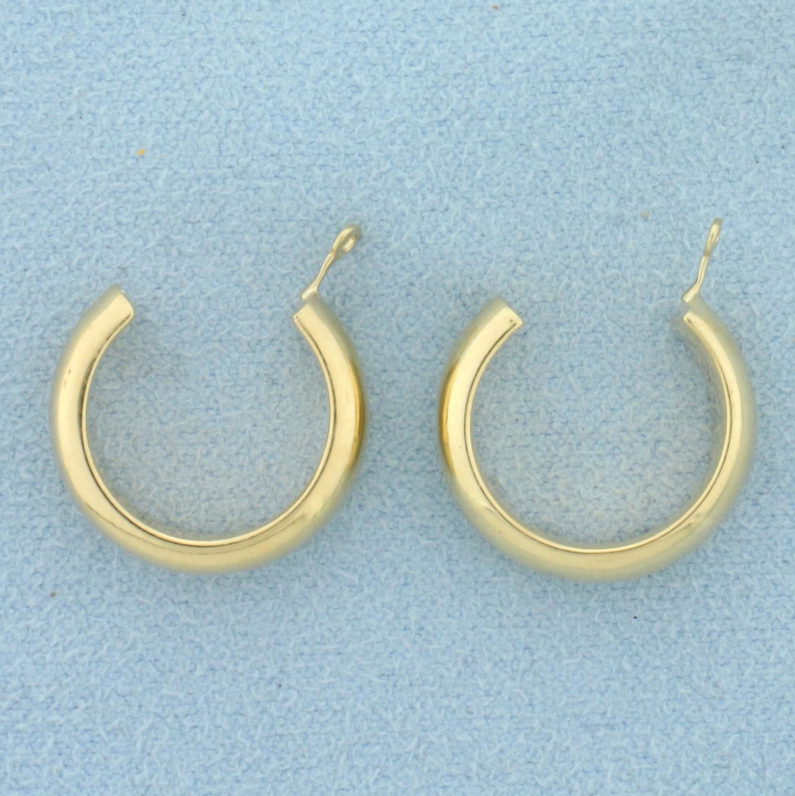 Hoop Stud Earring Enhancers in 14k Yellow Gold: In 14k yellow gold. 3/4 inch diameter. 2.1g.