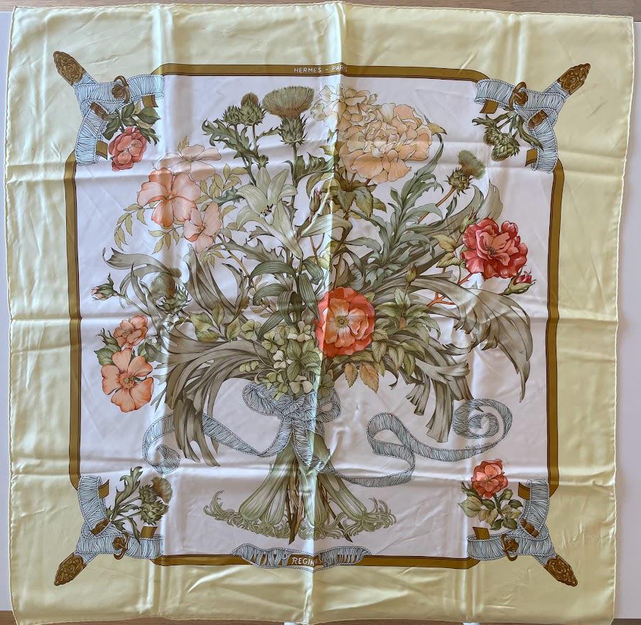 Hermes Regina Her Majesty the Queen Carre 90 Flower Bouquet Silk Scarf: Guaranteed authentic. Hermes 35" x 35" (90cm) vintage scarf in soothing colors. Made in France, 100% silk, hand rolled edges. Created by legendary Hermes artist Leila Menchari and inspired by Queen El
