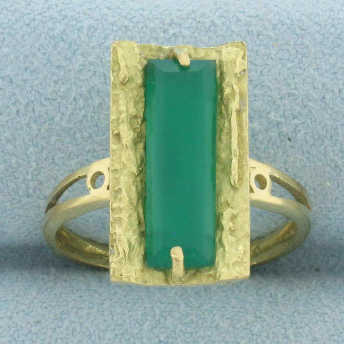 Designer Unique Emerald Ring in 18k Yellow Gold: In 18k yellow gold. Contains a 15.3 x 5.2 x 3.4mm high quality natural emerald with vibrant color and excellent clarity. Size: 7.5. 4.7g.