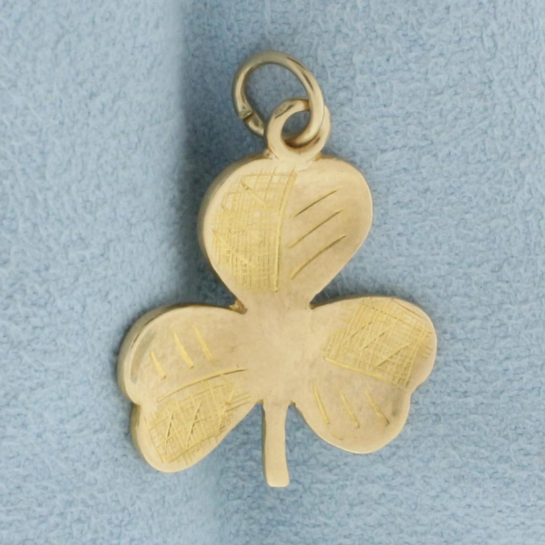 Shamrock Charm or Pendant in 14k Yellow Gold: In 14k yellow gold. 1 inch long, 3/4 inch wide. Etched design on leaves. 2.0g.