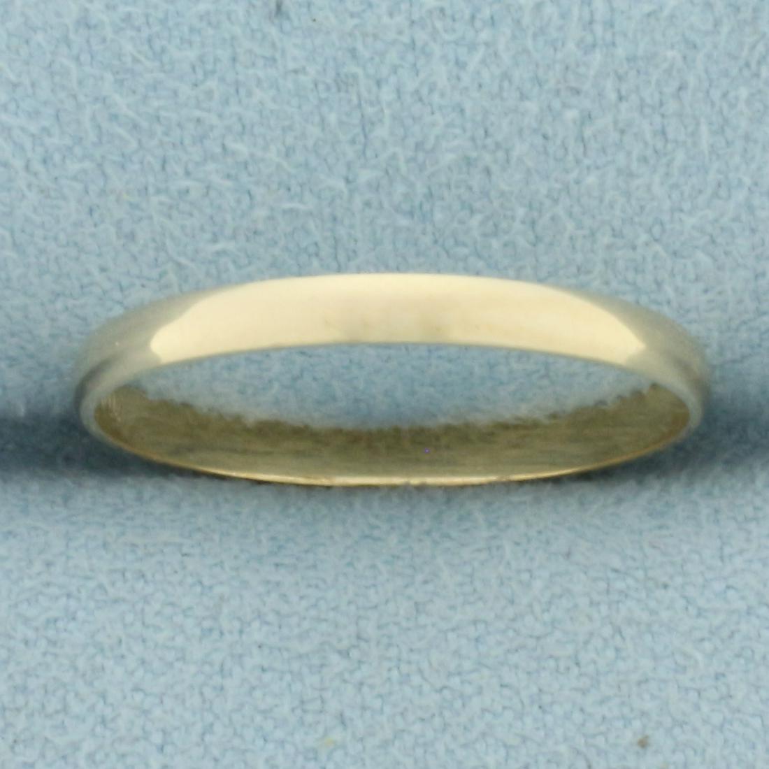 Thin Womans Wedding Band Ring in 14k Yellow Gold: In 14k yellow gold. 2mm wide. Size 8. 1.1g.