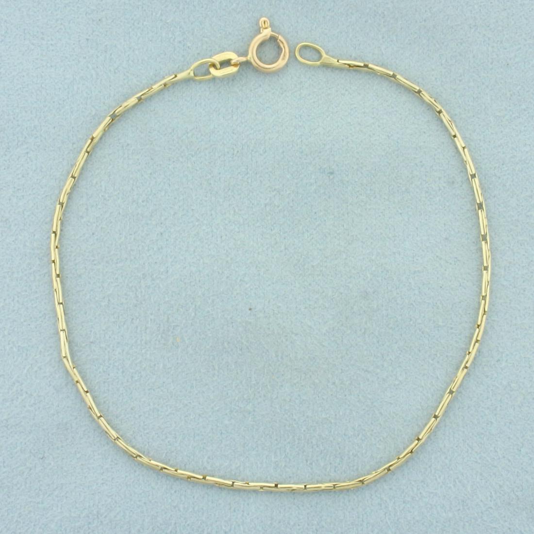 Italian Snake Link Bracelet in 14k Yellow Gold: In 14k yellow gold. Italian made. 7 3/4 inches long. 1.3mm wide. Spring clasp. 2.4g.