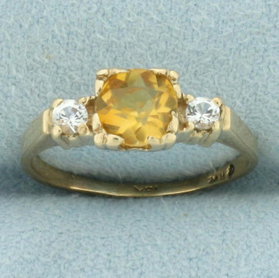 Antique Citrine and Diamond Ring in 18k Yellow Gold: In 18k yellow gold. Contains one high quality natural 6mm Old European Cut citrine gemstone with vibrant color and excellent clarity. Accented by two .07ct high quality white sapphire gemstones with e