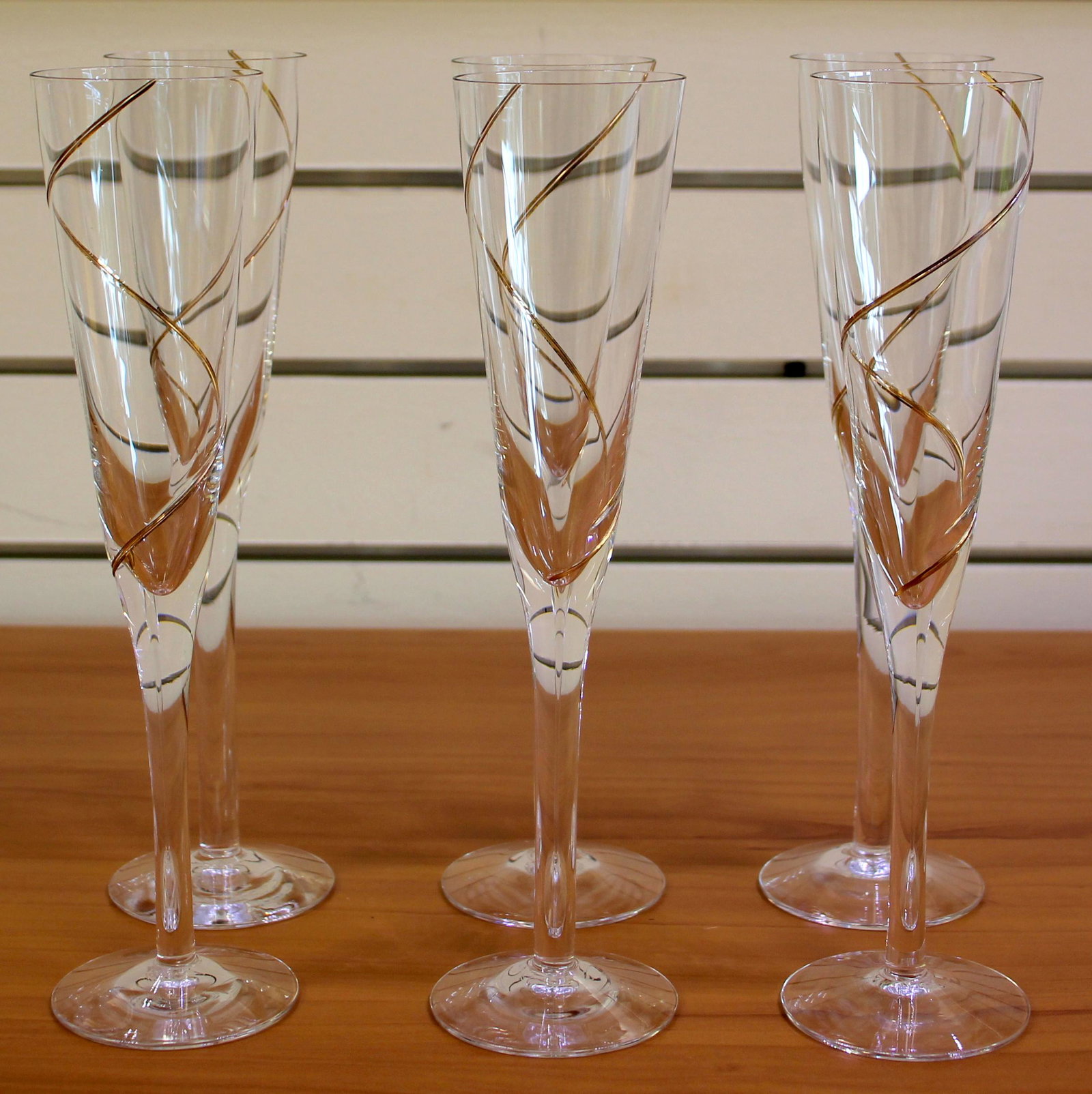 Kosta Boda Sweden Line Gold Fluted Champagne Glasses Set of 6: Kosta Boda "Line Gold", made in Sweden. Contains 6 fluted champagne glasses, 9.5 inches. Excellent condition.