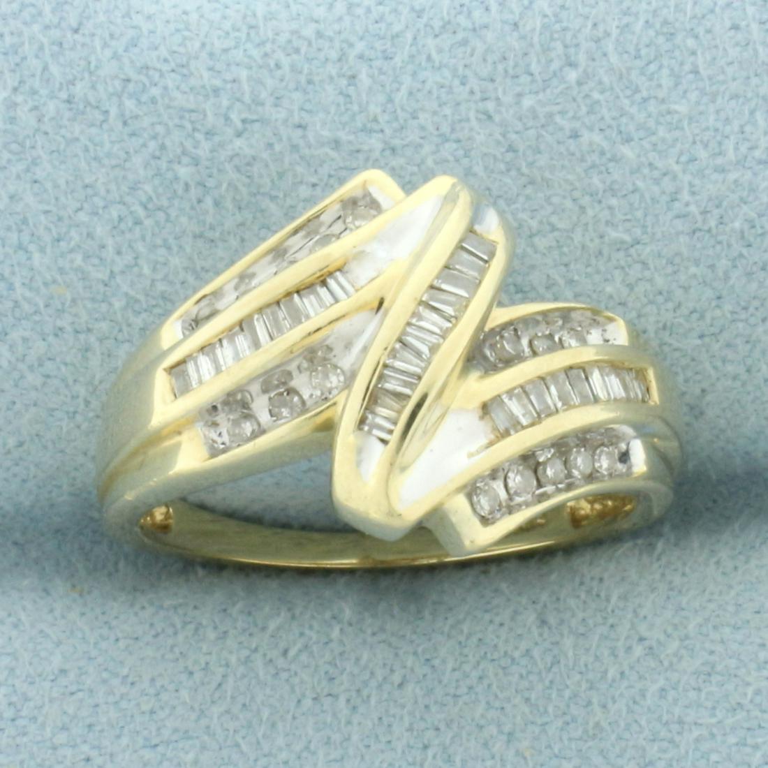 Diamond Zigzag Design Ring in 10k Yellow Gold: In 10k yellow gold. Contains 16 high quality round and 28 high quality baguette diamonds, 1/2ct TW, SI2 clarity/I color. 14.4mm wide at widest point. Size: 7.25. 4.0g.