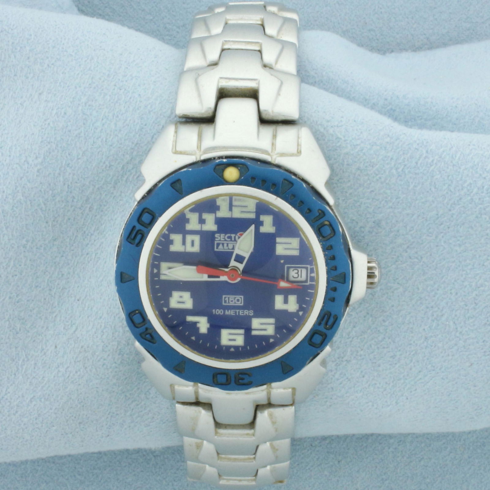 Vintage Ladies Sector Exp 150 Date Blue Dial Alutek Watch: 32mm Aluminum case. Quartz movement runs great, new battery. Serial #3253151735A. 100m water resistant. Great condition for age.