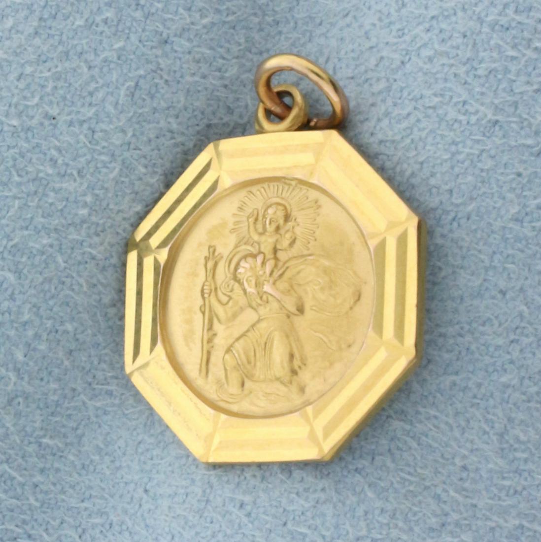 St. Christopher and Baby Jesus Charm or Pendant in 9k Yellow Gold: In 9k yellow gold. 7/8 inches ling (including jump ring) x 5/8 inches wide. 2.9g.