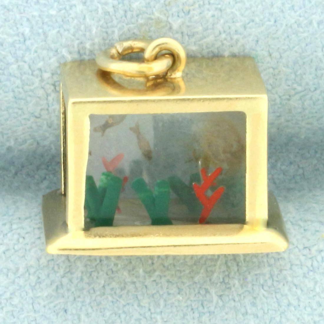 Vintage 3D Aquarium Charm in 14k Yellow Gold: In 14k yellow gold. Rare 3D aquarium wit fish, seaweed, and coral design inside. 9/16 inches wide x 3/8 inches deep x 1/2 inches tall. 2.1g.