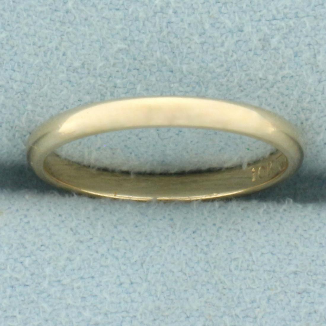Womans Thin Wedding Band Ring in 10k Yellow Gold: In 10k yellow gold. 2mm wide. Size: 5. 1.4g.