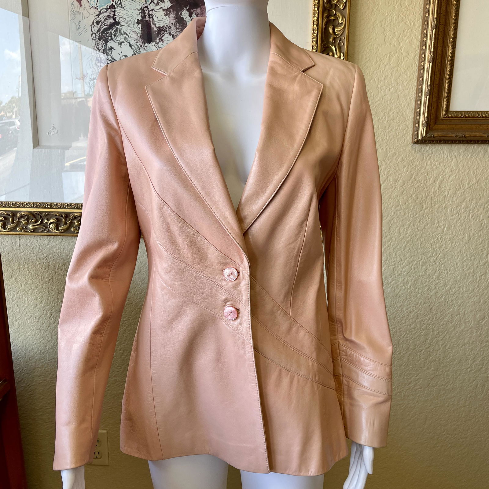 Escada Pink Lambskin Leather Blazer Jacket 38: Escada soft pink lambskin leather blazer with intricate diagonal swoop design. Iridescent tonal pink buttons with Escada signature logo. Fully lined with Escada signature logo fabric. Original receipt