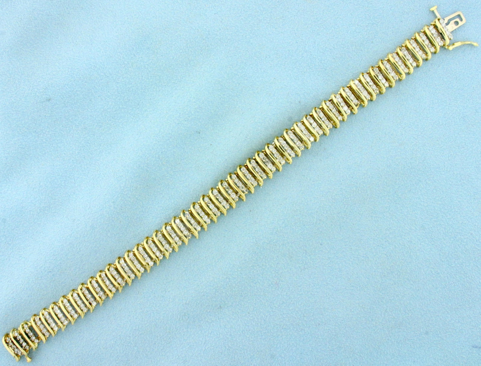 2ct TW Diamond Tennis Bracelet in 10K Yellow Gold: In 10K Yellow Gold. Contains two hundred and thirty five high quality Diamonds, 2ct TW, I clarity/I color. 7 1/2 inches long. Safety clasp. 16.6g