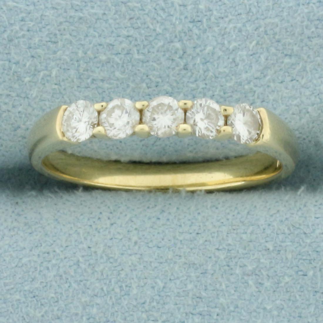 Diamond Wedding or Anniversary Band Ring in 14k Yellow Gold: In 14k yellow gold. Contains 5 high quality diamonds, 1/2ct TW, SI clarity/G color. Size 7.5. 2.3g.