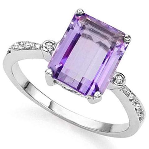 3CT Amethyst and Diamond Ring in Sterling Silver: Emerald cut 3.1ct amethyst gemstone ring accented with .01ctw genuine diamonds. Size 7. Set in platinum over sterling silver, 2.7g.