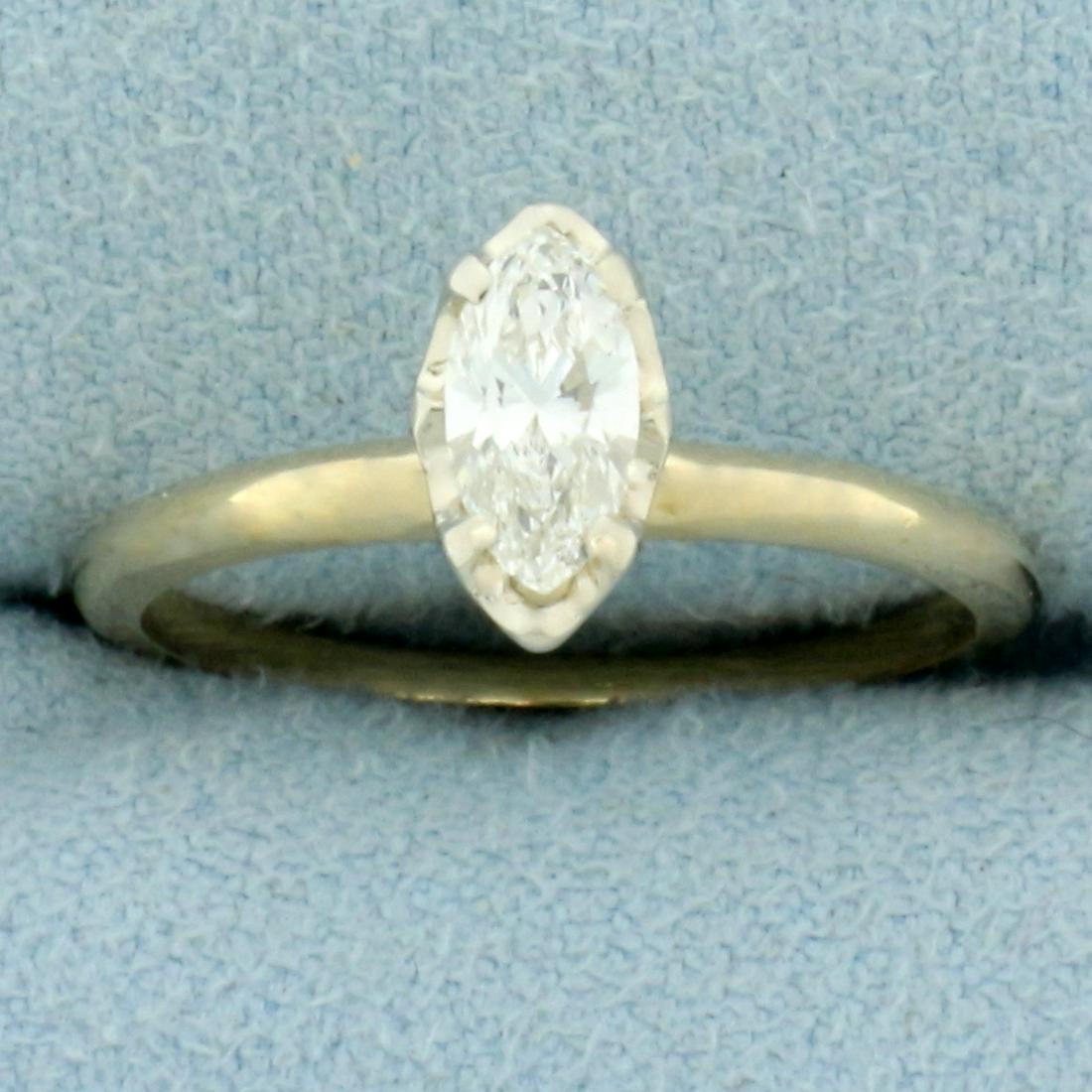 Marquise Diamond Illusion Setting Solitaire Engagement Ring in 14k Yellow Gold: In 14k yellow gold with 14k white gold head. Contains one high quality marquise cut .40ct diamond, VS clarity/H color, great cut for lots of sparkle. Set in white gold illusion head to make diamond ap