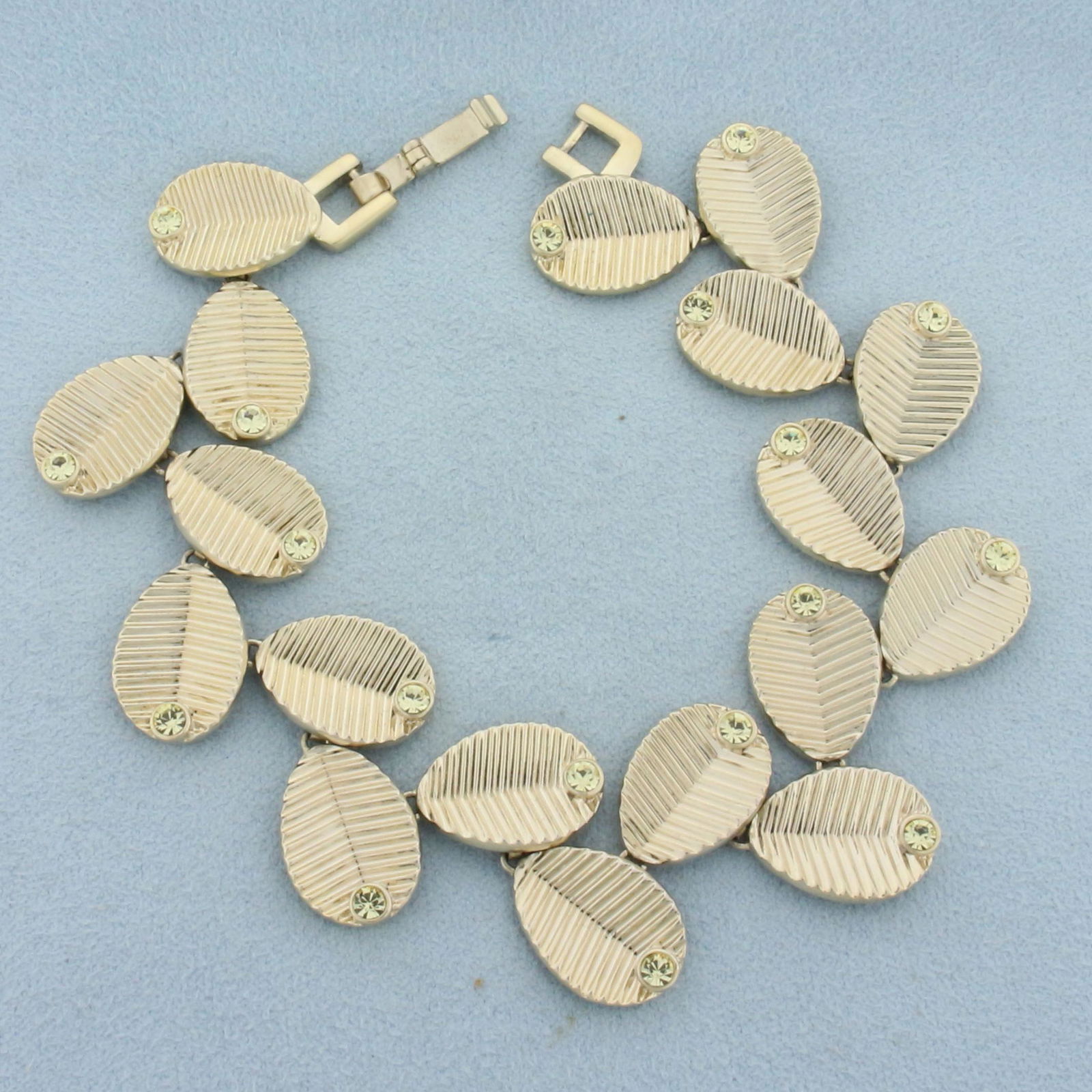 Clarion Pell Princess Grace Of Monaco Crystal Leaf Bracelet: Gold plated. Excellent condition (like new). #47194. 7 1/4 inches long with extension link (1 1/4 inches extra), 1 inch wide. With original box, papers, manufacturer certificate, and box cover.