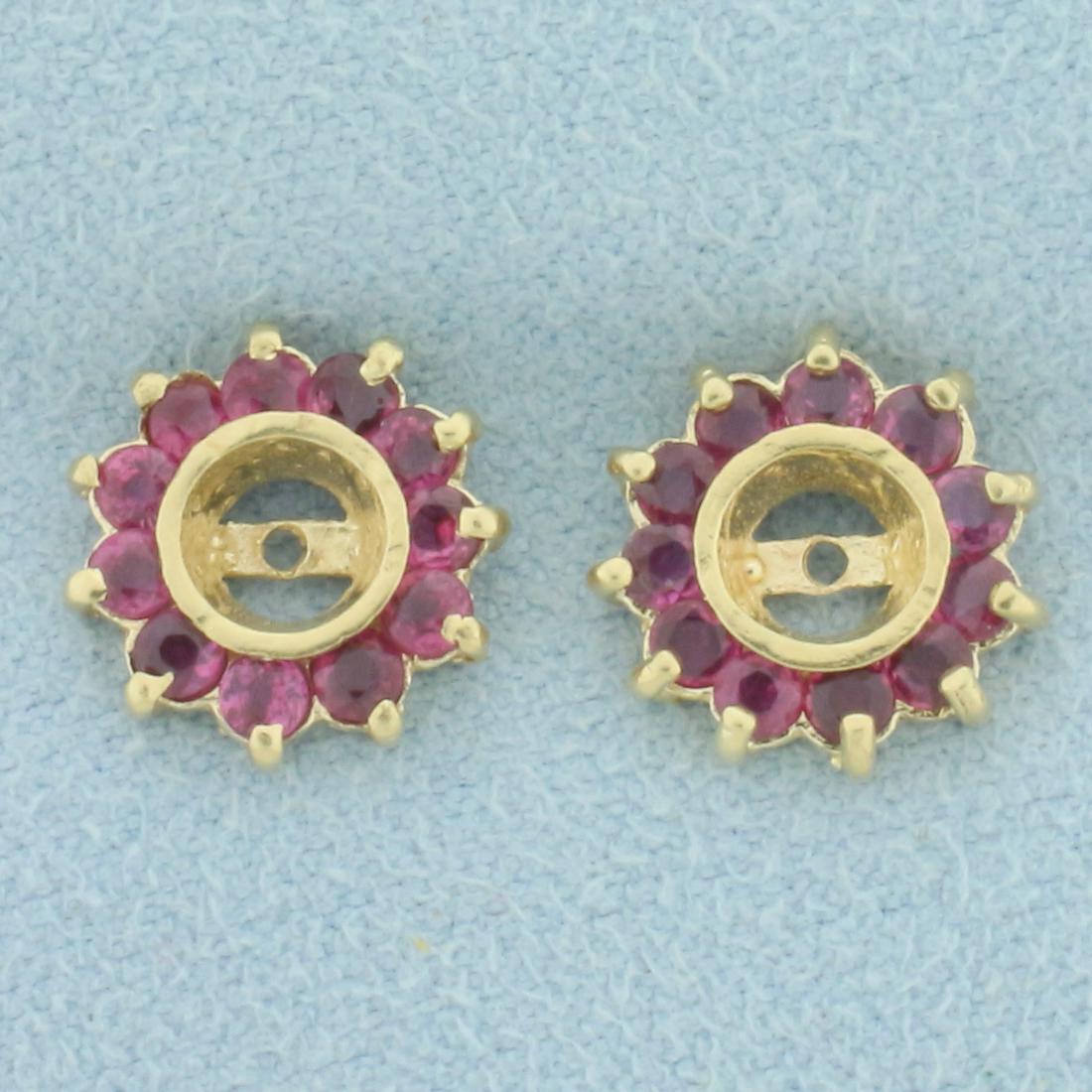 Ruby Stud Earring Enhancers in 14k Yellow Gold: 14k Yellow Gold. Contains 22 high quality natural Rubies, 1ct TW, with vibrant color. Rubies: 1/2 inch diameter. Create a colorful halo around any diamond stud earrings. 1.9g.