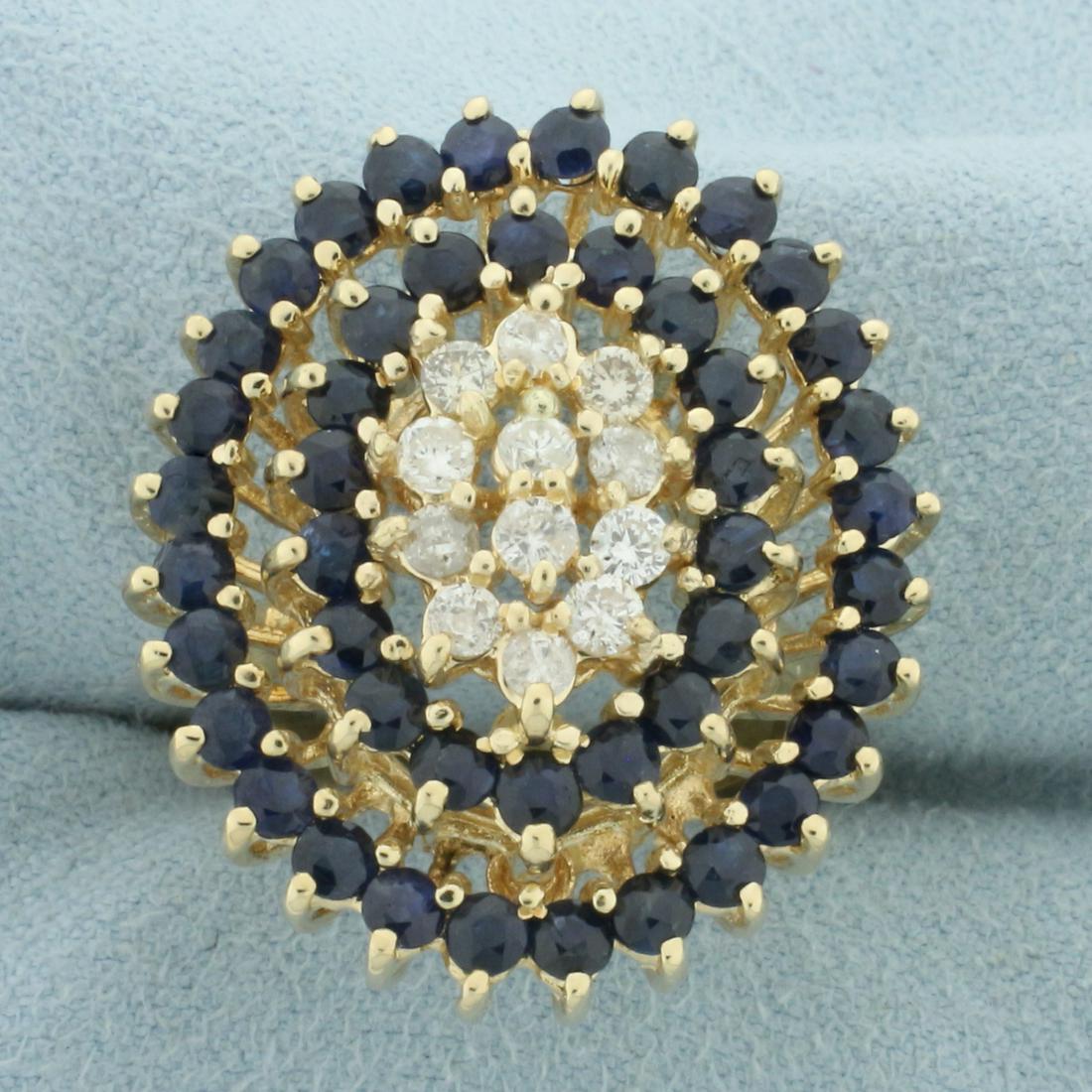 Vintage Sapphire and Diamond Oval Ring Design Ring in 14k Yellow Gold: In 14k yellow gold. Contains forty six high quality natural Sapphire gemstones, 2.5mm each, with intense color and excellent clarity. Also contains twelve high quality diamonds, 1/2 ct TW, SI clarity/