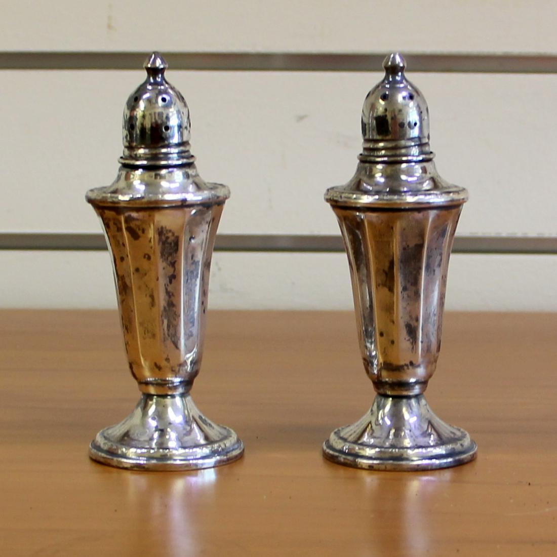 Antique National Silver Co. Sterling Silver Salt and Pepper Shaker Set: In .925 sterling silver (weighted base). 1.75 inch diameter bases, 4 5/8 inches high. 82.7g.