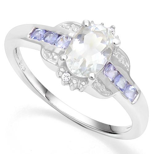 Aquamarine and Tanzanite Ring in Sterling Silver: Oval cut 2/3ct light aquamarine and 1/4ctw tanzanite gemstone ring. Vintage inspired mounting in platinum over sterling silver, size 7. 2.3g