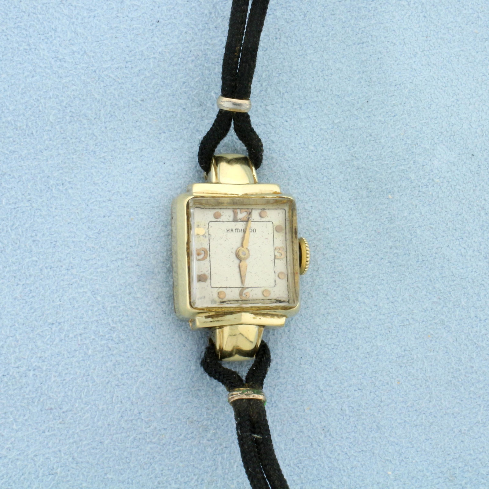 Vintage Ladies Hamilton Watch in Solid 14k Gold Case: Solid 14k Yellow Gold Case. Case 16mm. Corded bracelet. Windup movement runs great. Monogram on back as shown in picture. 10.4g