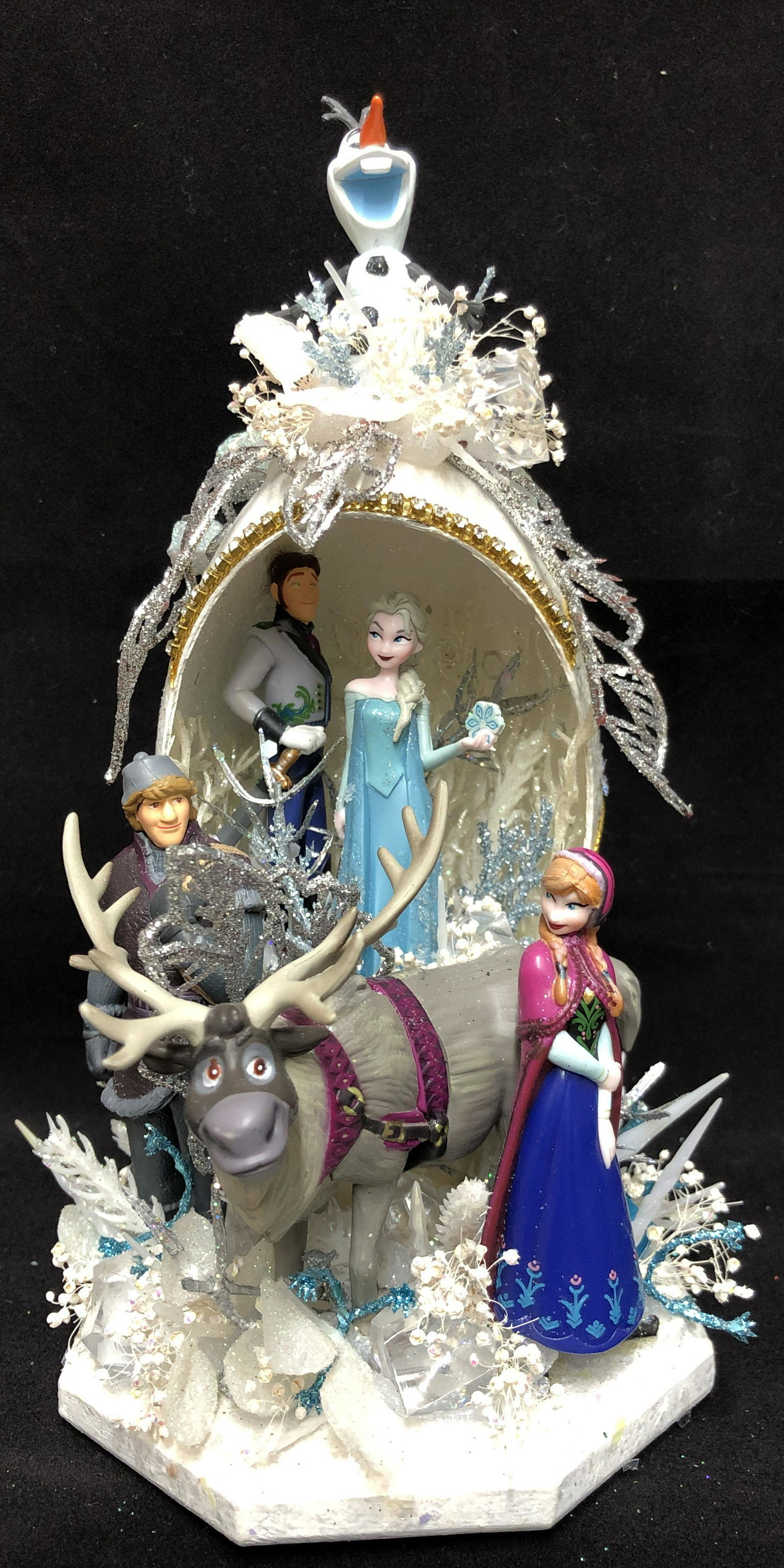 Disney Frozen Hand Created Emu Egg Sculpture: Exquisite hand decorated collectible, created from a real emu egg. The egg is cleaned, hand carved and painted with Luminere metallic paints and glittered to compliment the theme of the Disney charact