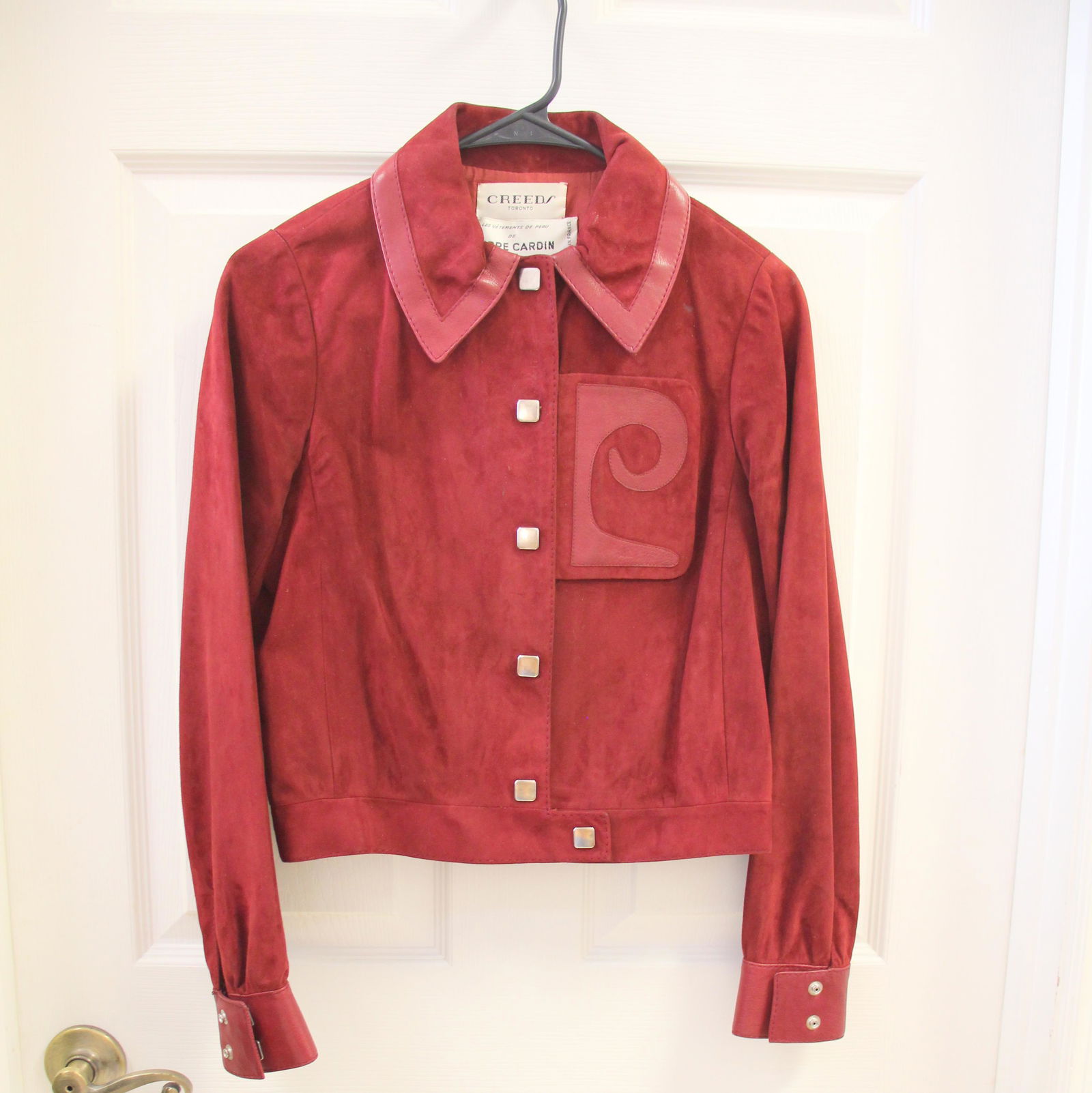 Creeds Toronto Pierre Cardin Burgundy Red Logo Suede Leather Suit Set: Size 40. Super rare find! Amazing silver toned hardware. Iconic Pierre Cardin oversized logo detail.Dark red / burgundy color. Skirt zips and buttons up. Excellent vintage condition with minor imperfe