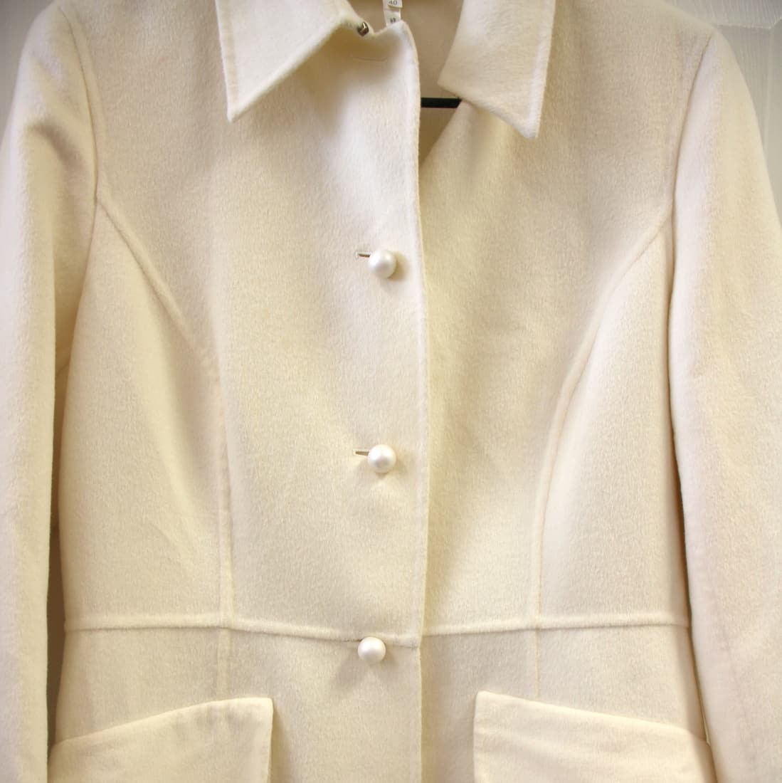 Escada Rabbit Wool Dressy Pearl Button Coat: Size 40. Vintage Escada. Made in Italy. 45% Rabbit, 45% wool, 10% cashgora. Lined armholes. Oversized pearl buttons. Extra button still attached inside. Great vintage condition with minor imperfection