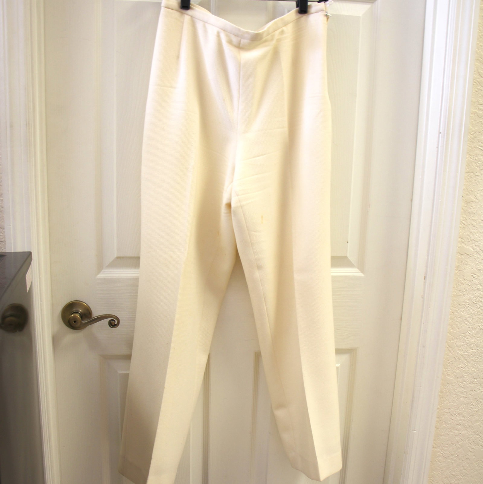 Escada Cream Wool Pants: Size 40. Vintage Escada. 100% new wool. Fully lined with rayon. Side Zip. Vintage condition with stains/imperfections.