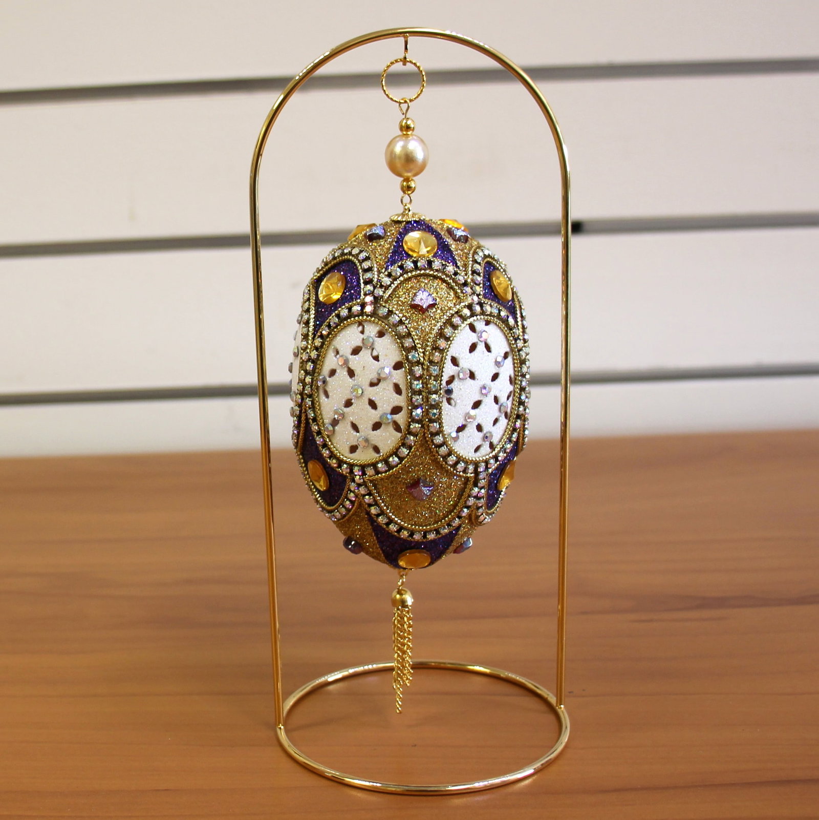 Heirloom Faberge Style Goose Egg Ornament with Stand: A real ordinary goose egg is transformed into an extraordinary ornament worthy of passing down generation after generation. The goose egg is marked into an elegant pattern and the 6 center ovals are c