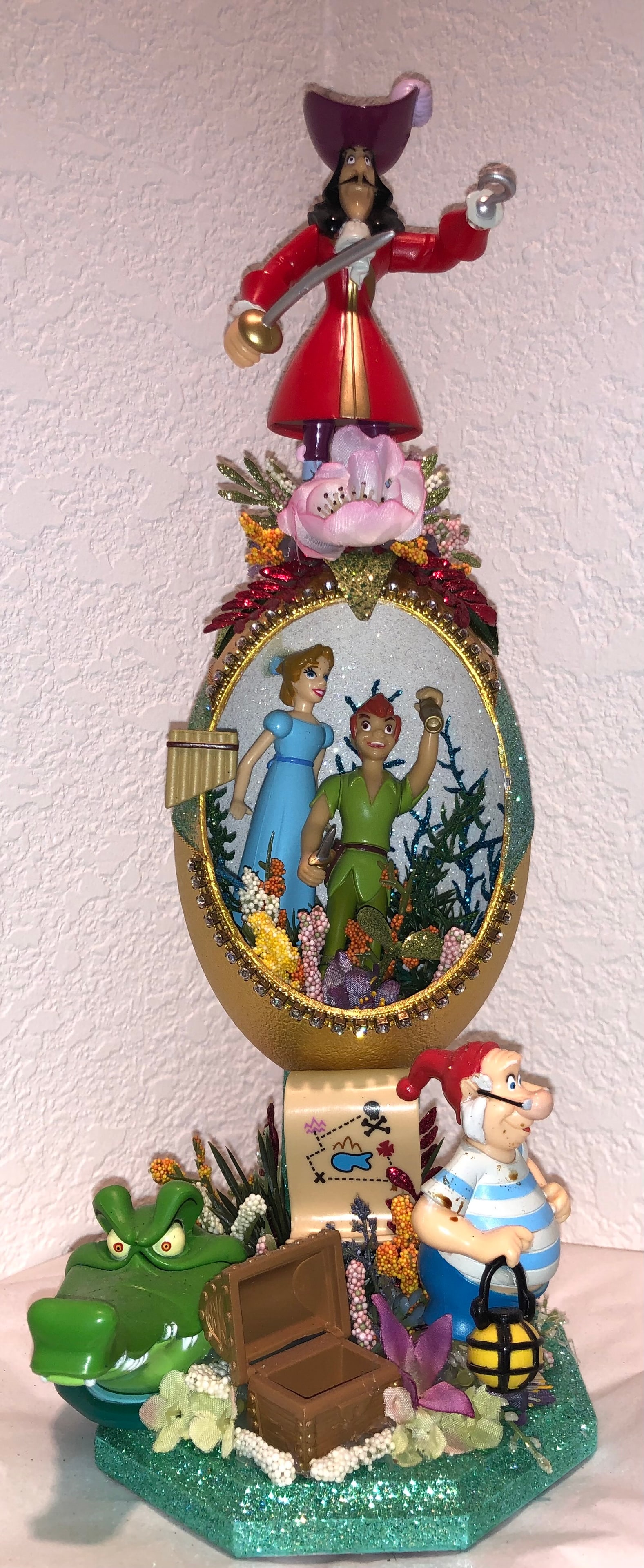 Disney Peter Pan Hand Created Emu Egg Sculpture: Exquisite hand decorated collectible, created from a real emu egg. The egg is cleaned, hand carved and painted with Luminere metallic paints and glittered to compliment the theme of the Disney charact