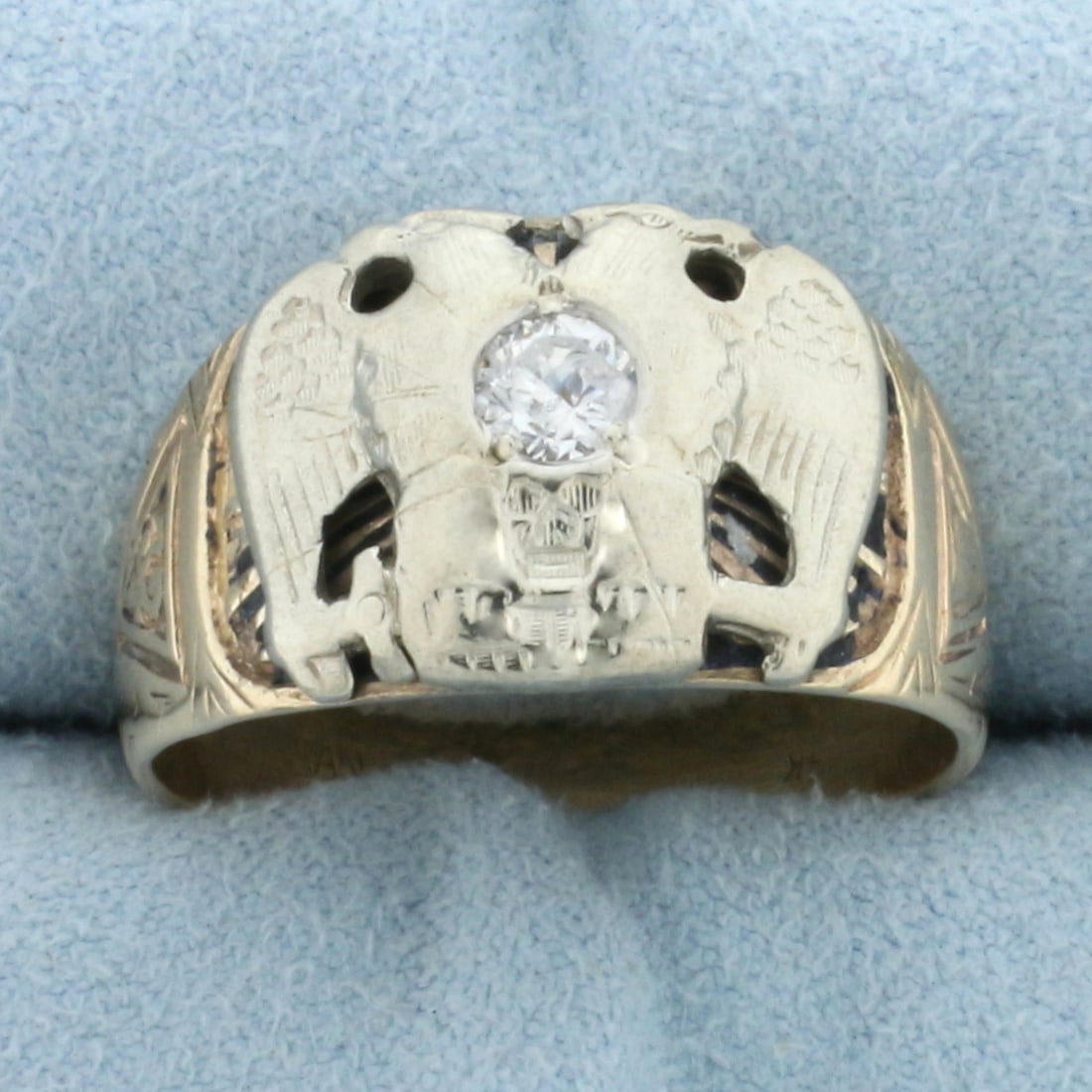 Vintage 32 Degree Scottish Rite Masonic Ring in 14k Yellow and White Gold: In 14k yellow and white gold. Contains one 1/4ct CZ gemstone. Note CZ does have a chip. Skull symbol on ring. Approximately 12.6mm at widest point. Size 10. 8.1g.