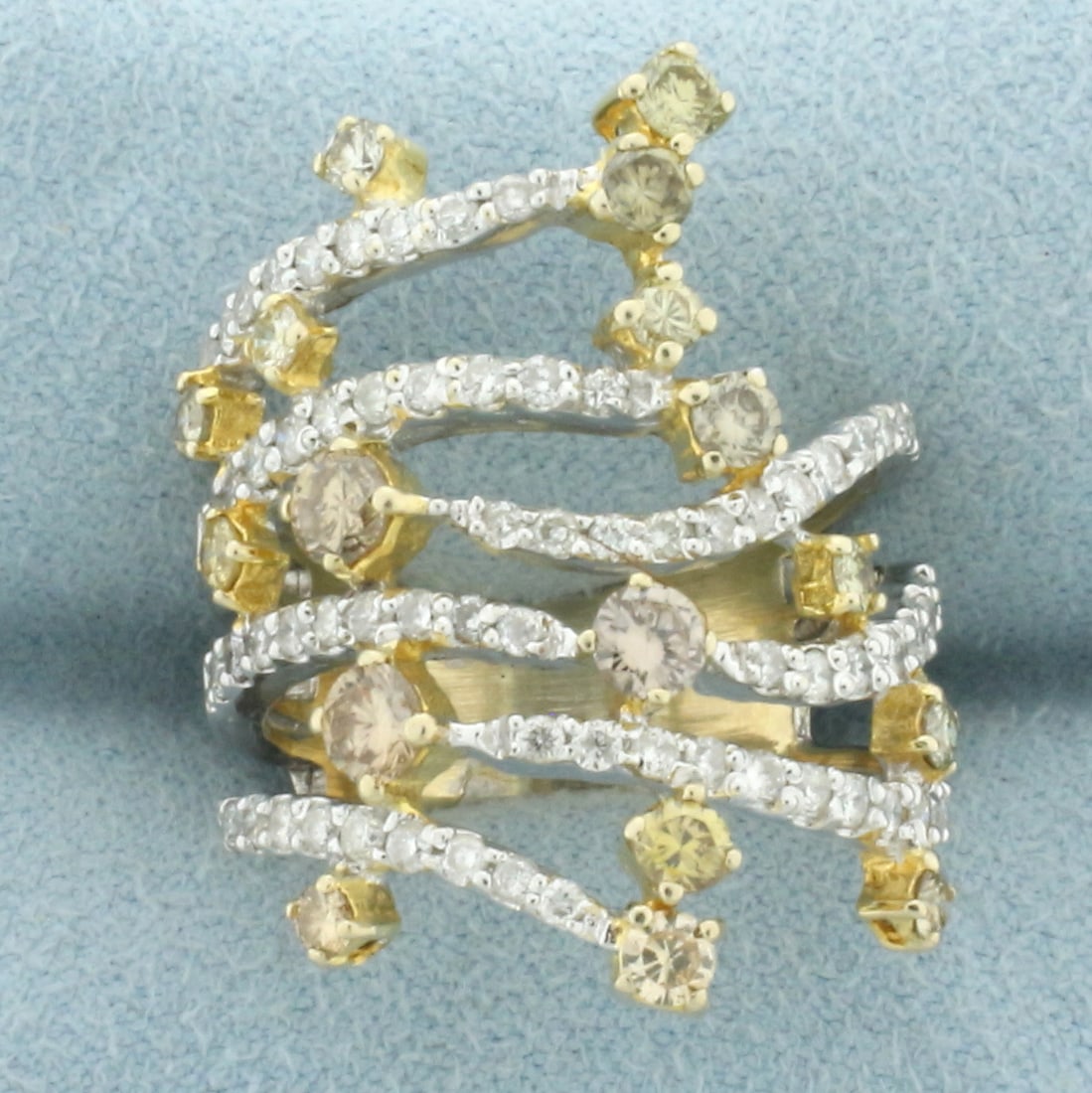 Fancy Yellow, Champagne, and White Diamond Ring in 18k White Gold: In 18k white gold. Contains 84 high quality round brilliant "white", fancy yellow, and champagne diamonds ranging from .01ct to .15ct each. 2ct TW, SI clarity. Size: 8. 8.6g.