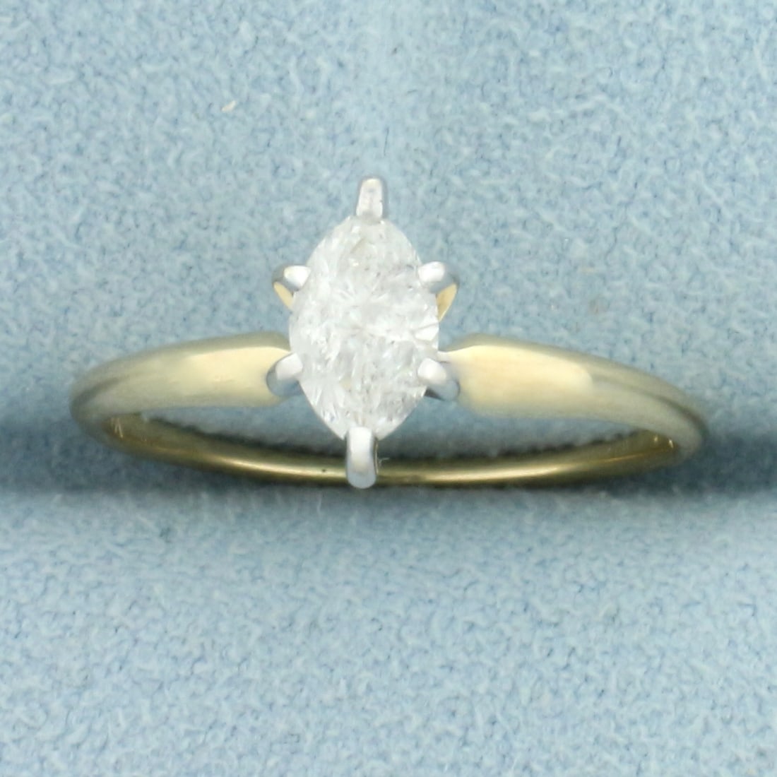 Marquise Solitaire Diamond Engagement Ring in 14K Yellow Gold: In 14K Yellow Gold with white gold head. Contains one high quality 1/2ct marquise cut diamond, I clarity/H color. Size 5 3/4. 1.6g.