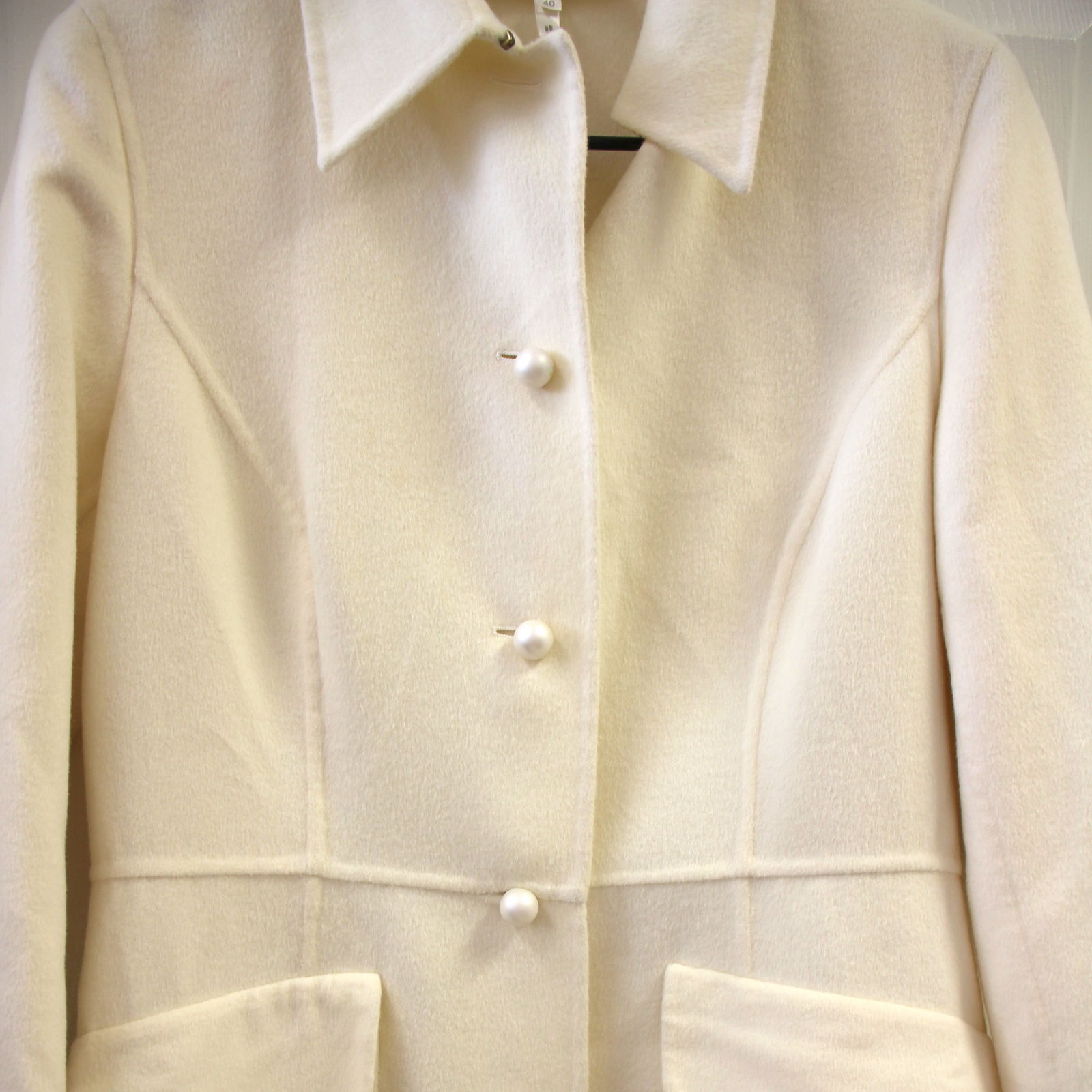 Escada Rabbit Wool Dressy Pearl Button Coat: Size 40. Vintage Escada. Made in Italy. 45% Rabbit, 45% wool, 10% cashgora. Lined armholes. Oversized pearl buttons. Extra button still attached inside. Great vintage condition with minor imperfection