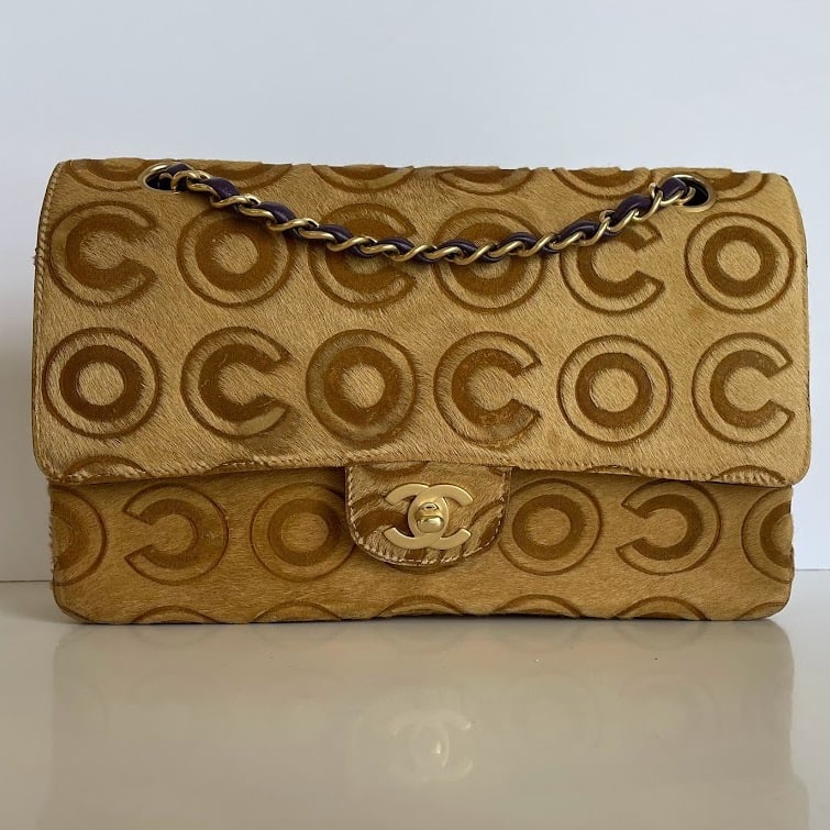 Chanel Limited Edition Coco Pony Hair Classic Exotic Double Flap Bag: Guaranteed authentic with box, dustbag, hologram serial number sticker in bag. Rare, extremely limited edition featuring exotic brown and tan pony hair with a graphic Coco logo design. Brushed matte g
