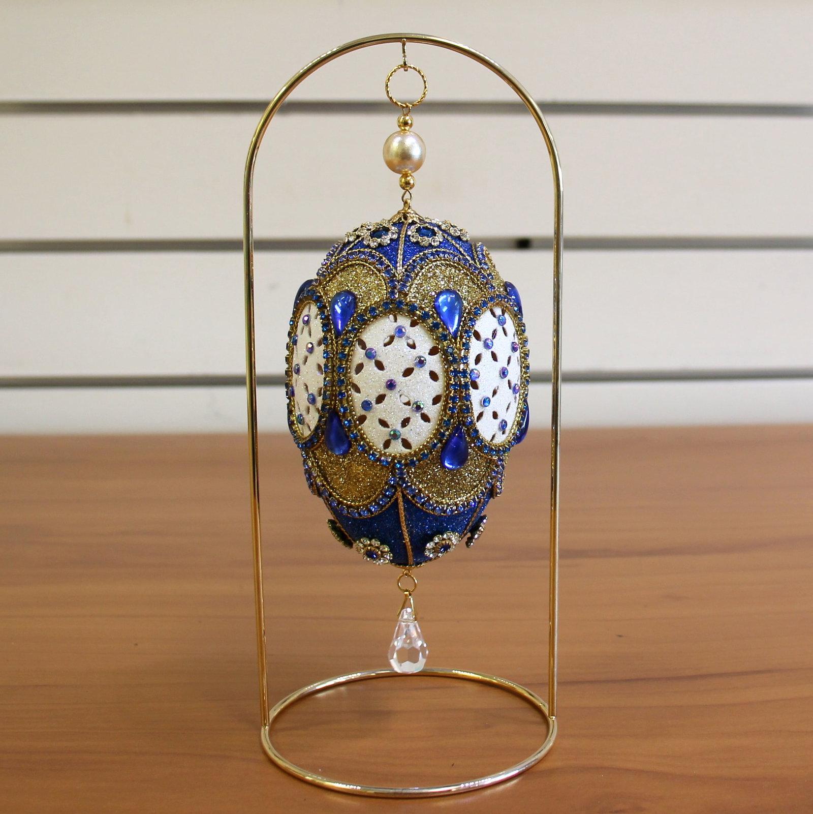 Heirloom Crystal Goose Egg Ornament With Stand: Real Goose Egg accented by Swarovski Crystals and ultrafine glistening glitter. Lattice pattern expertly created on egg using a high speed dental drill. This entire egg is meticulously detailed and cr