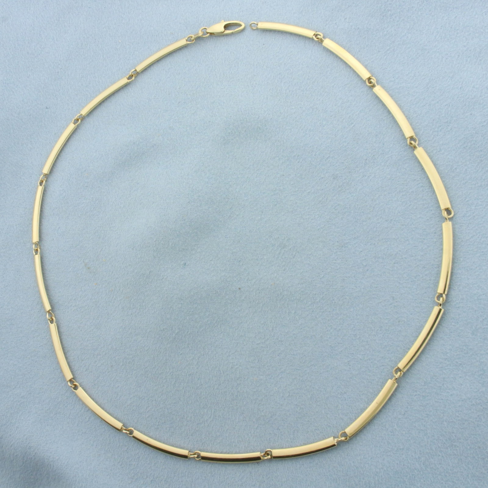 Italian Made Curved Link Choker Chain Necklace in 14k Yellow Gold: In 14k yellow gold. 15.5 inches long (each link is approx. 7/8 inches long). 3mm wide. Lobster clasp. 9.8g.