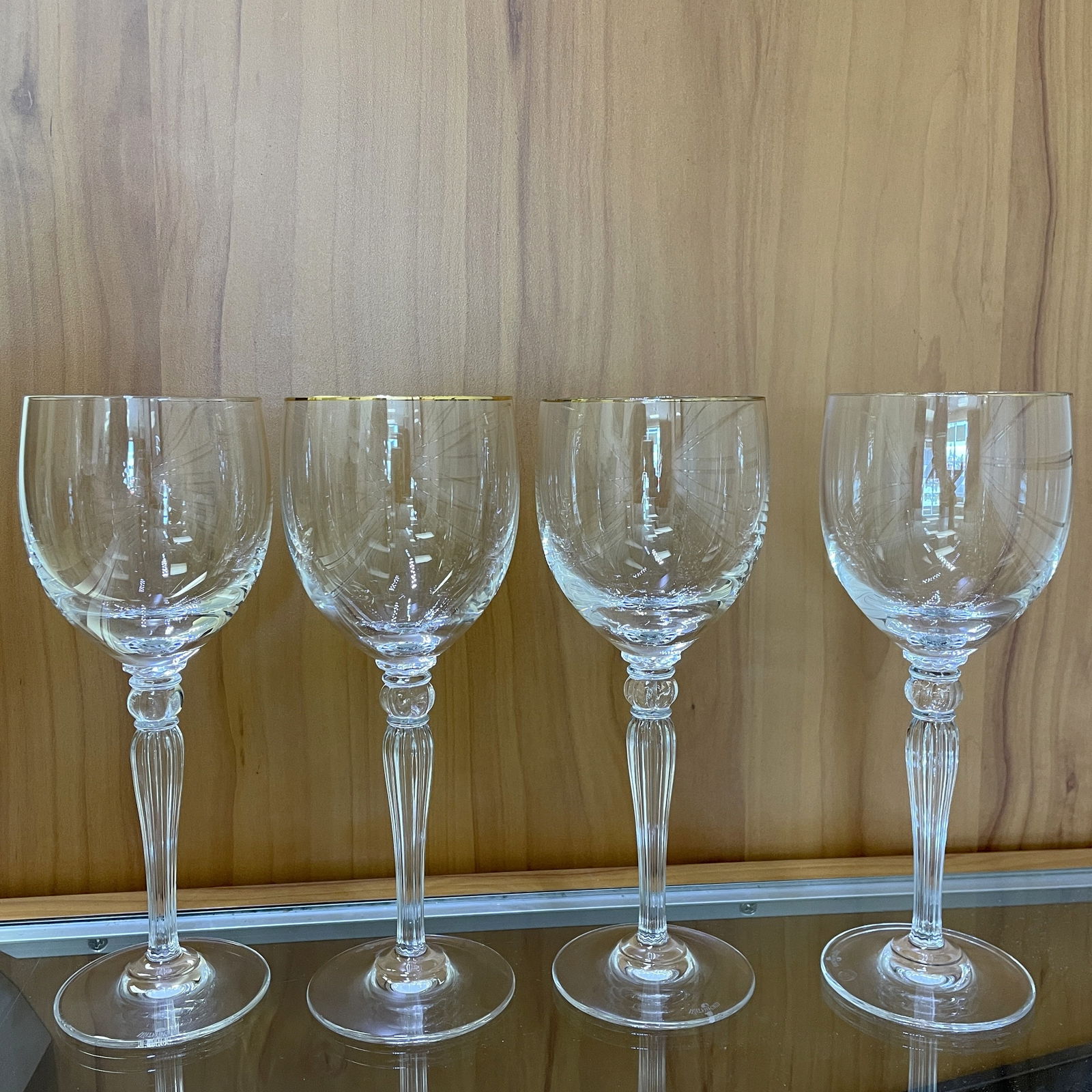 Waterford Carelton Gold Crystal Wine Goblets Set of 4: Good condition, some gold rims show signs of wear. Four water goblets 7.75 inches. Waterford acid etch mark on bases.